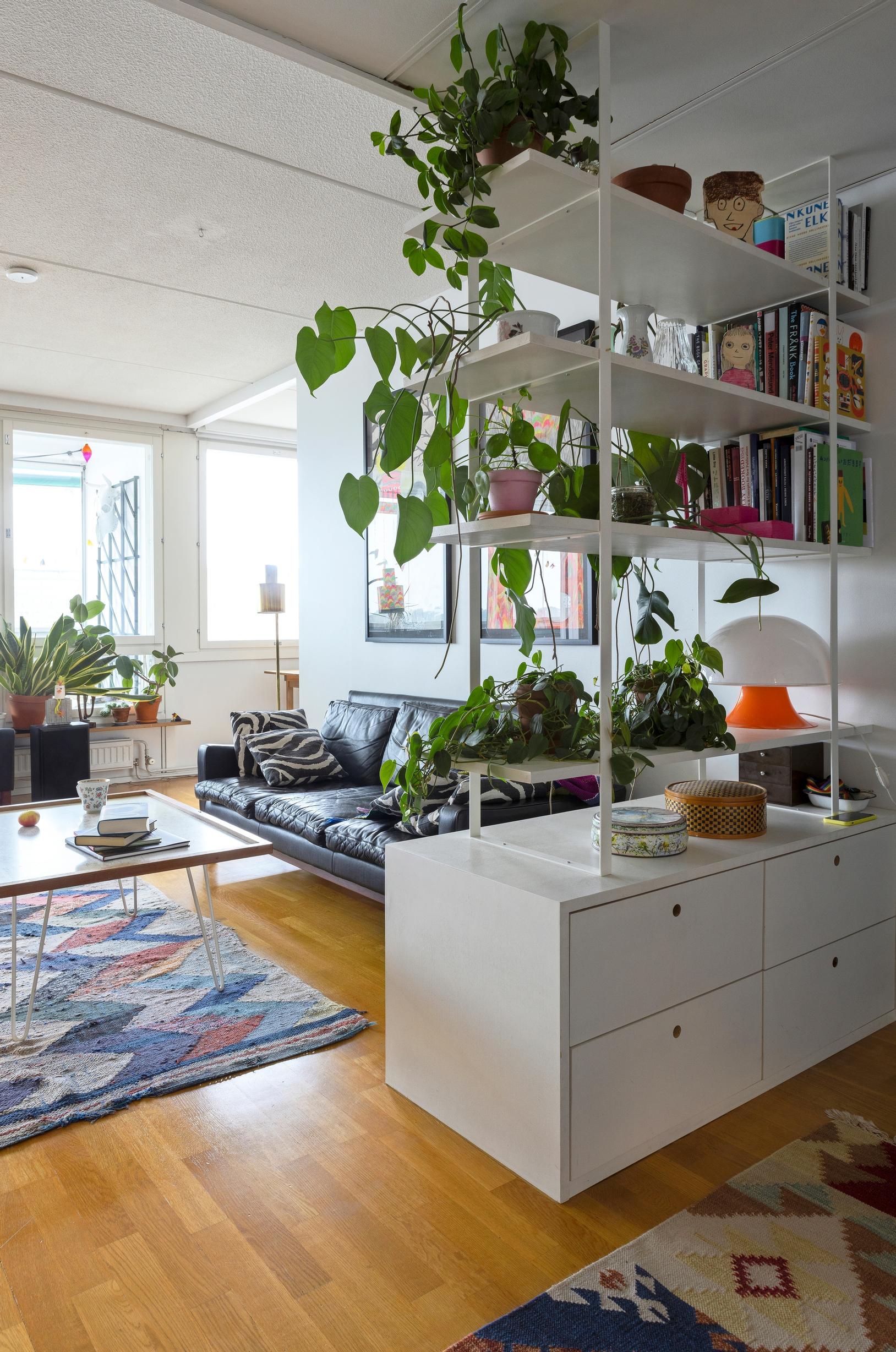 Open shelving as a room divider in the entryway