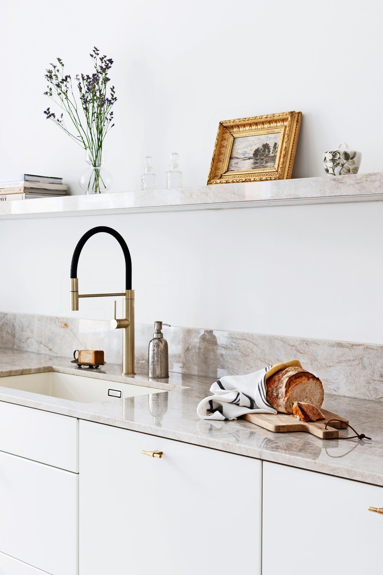 Kitchen countertops and shelf made from Taj Mahal quartzite.
