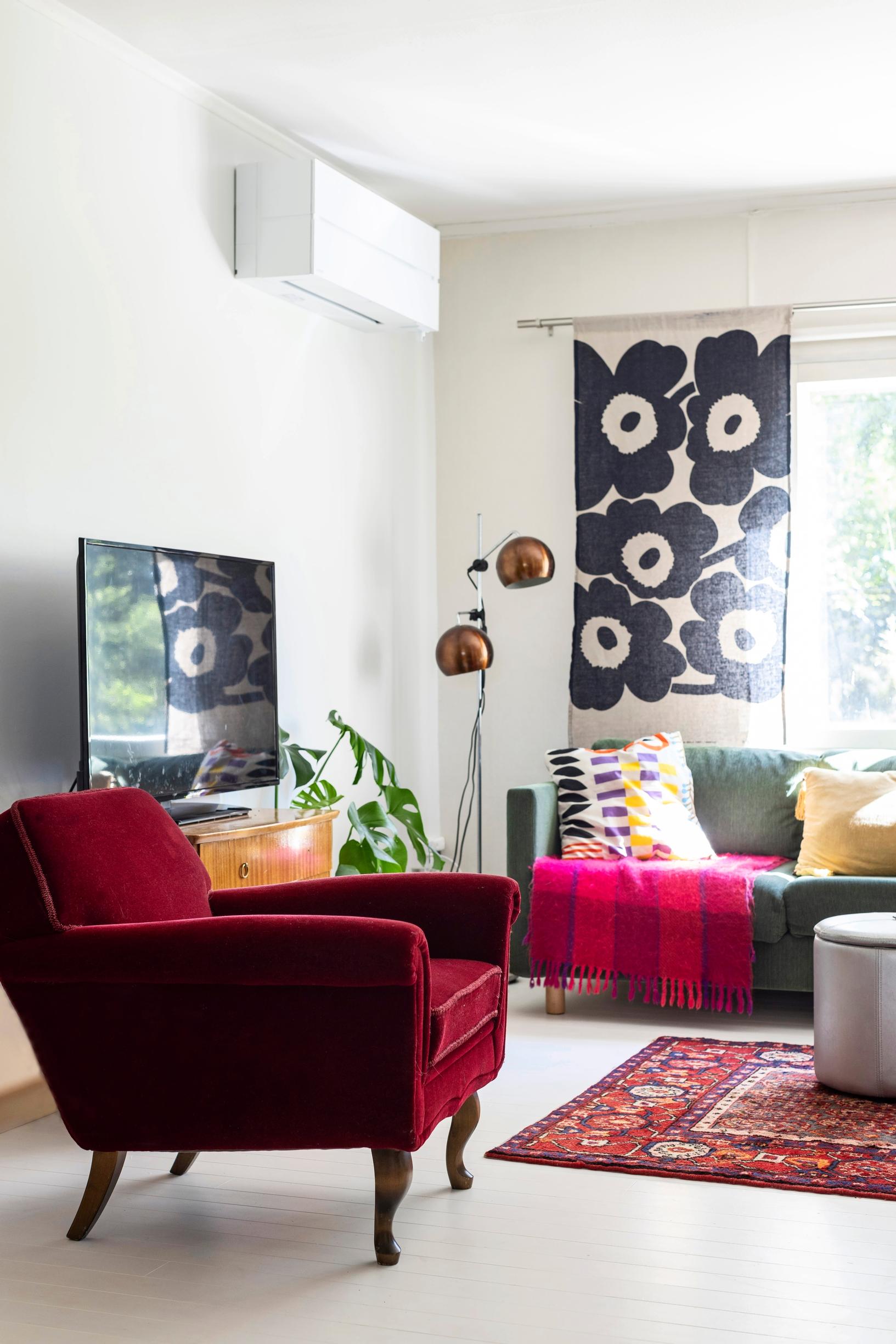 A red vintage armchair in the cottage living room