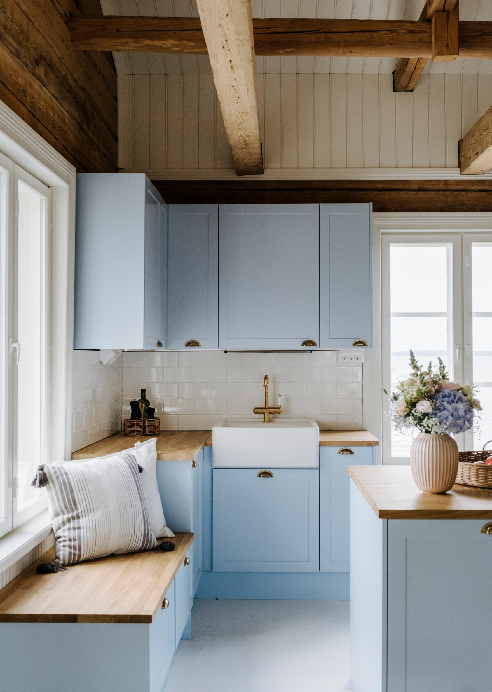 Window bench in the Harlins’ light blue kitchen
