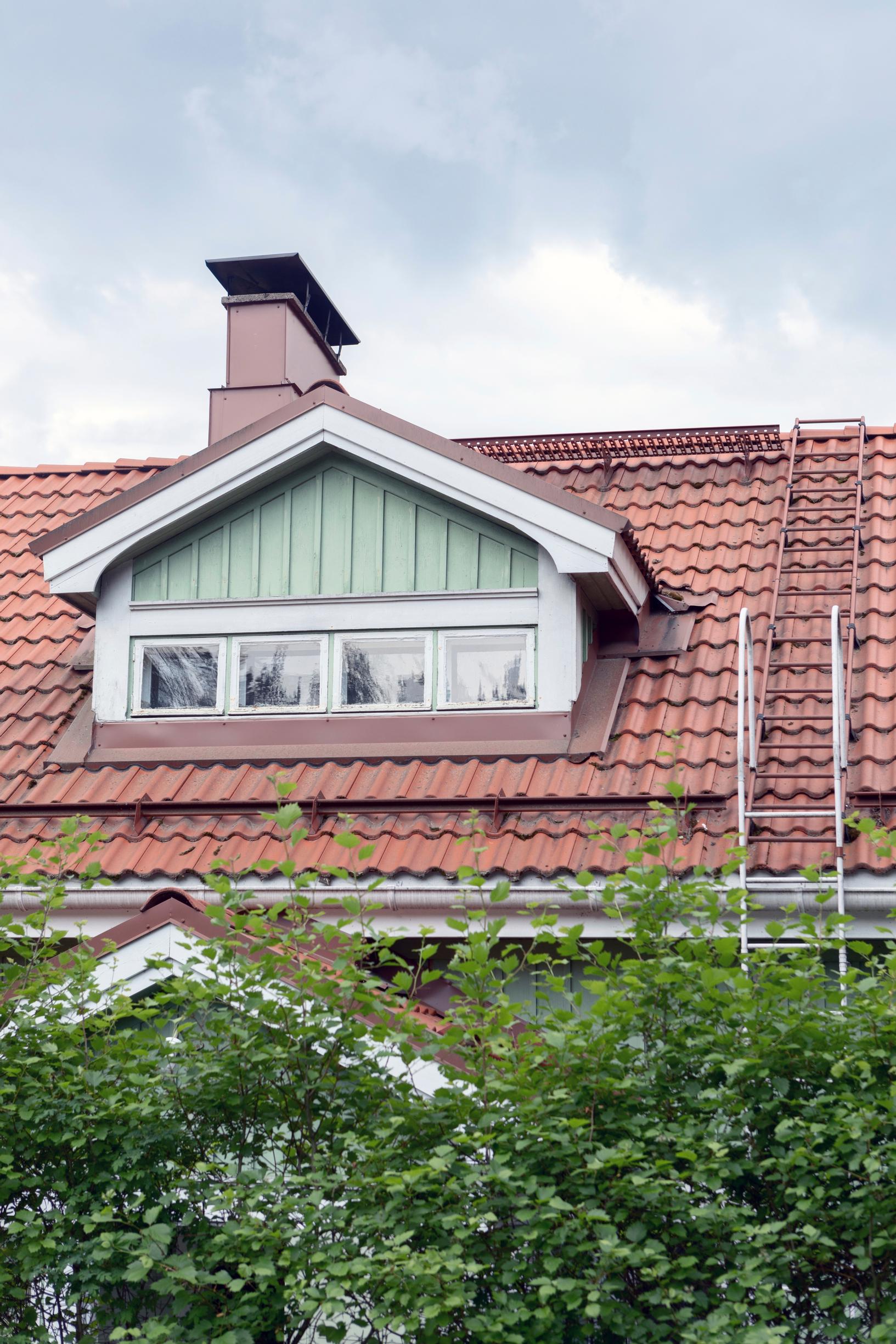 A roof lantern on a wooden house 