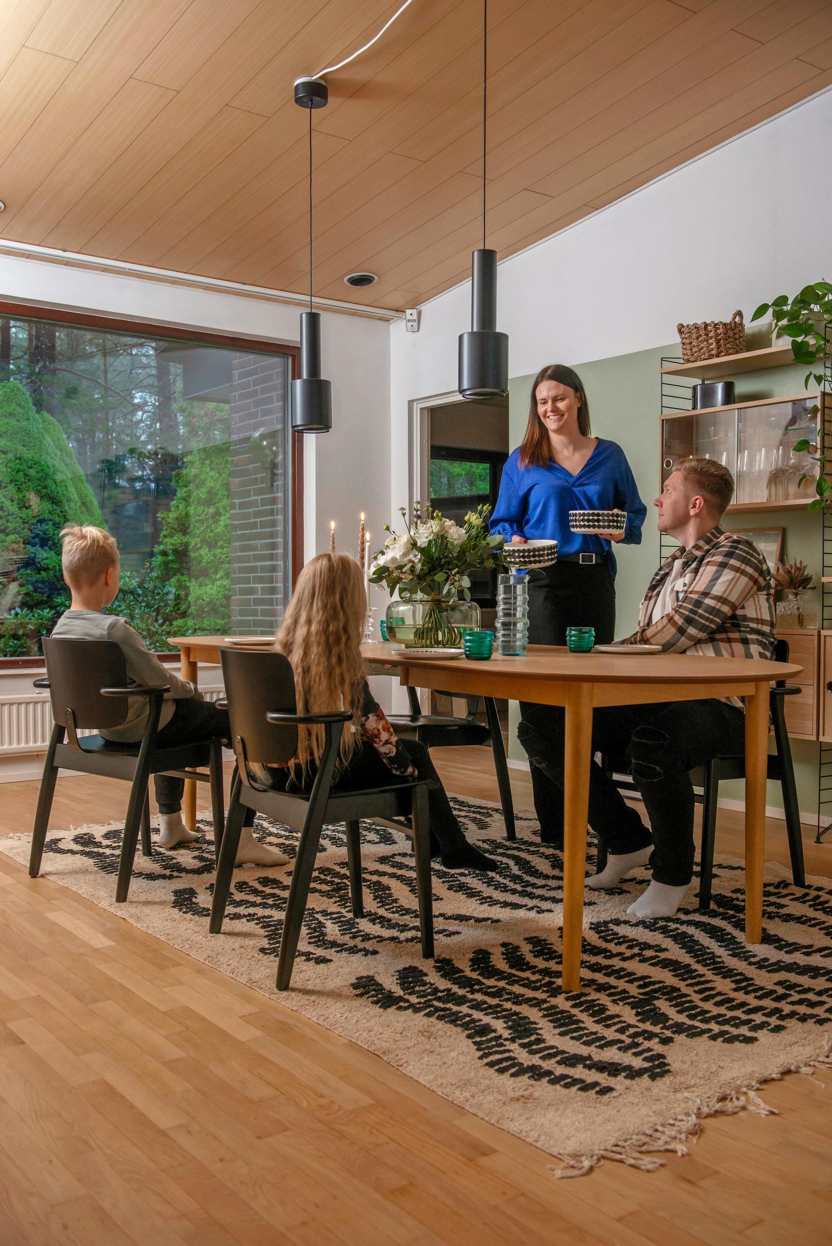 Image of a family in their dining area.