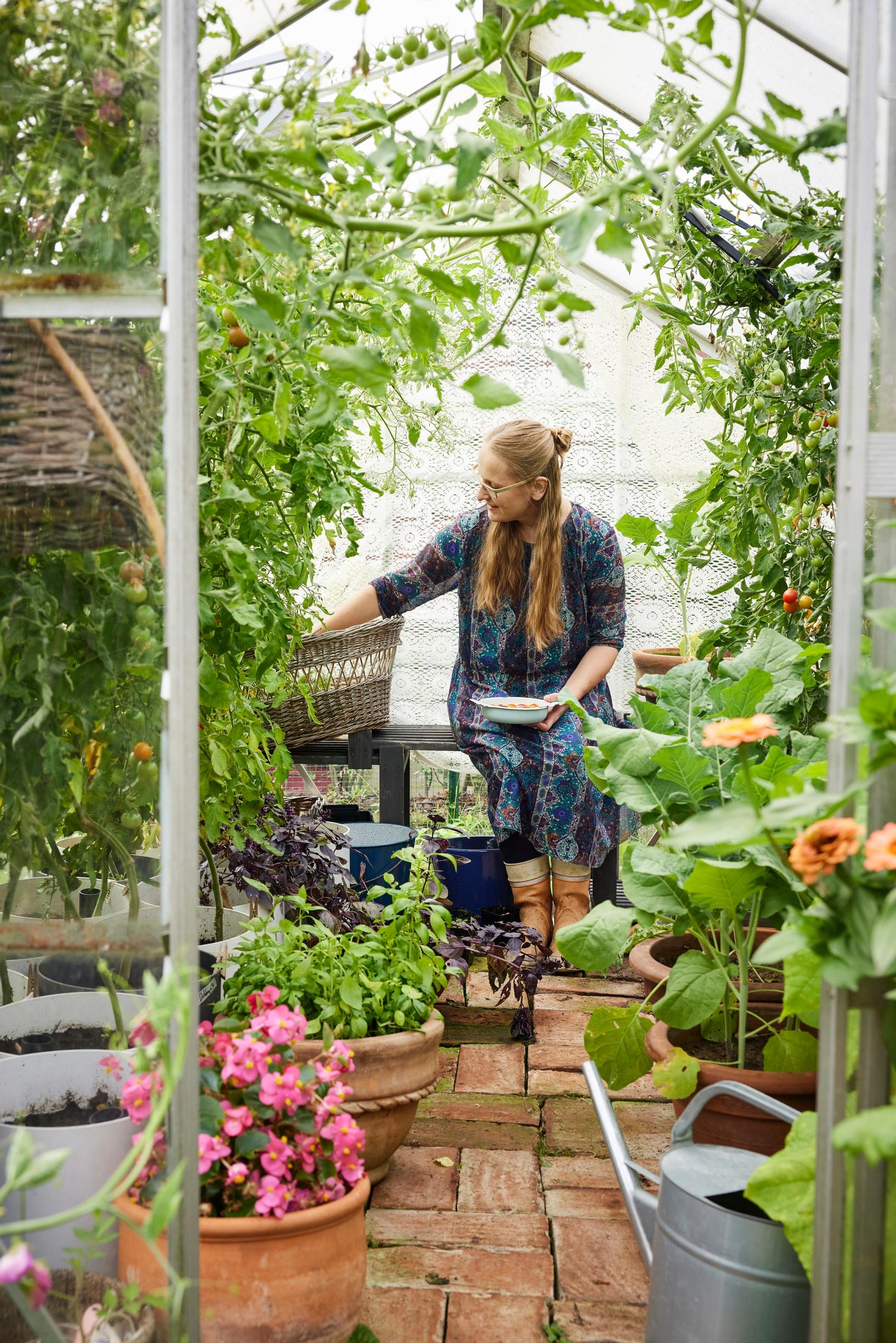 Satu Koivisto in the greenhouse