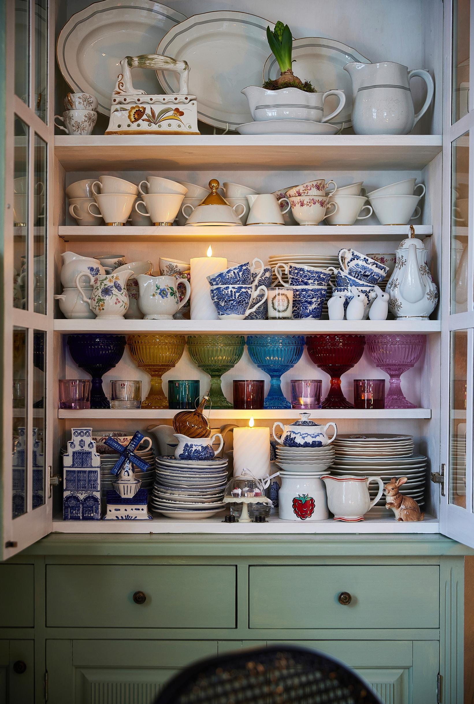 The large Juvi china cabinet in the dining area holds a huge amount of dishes.