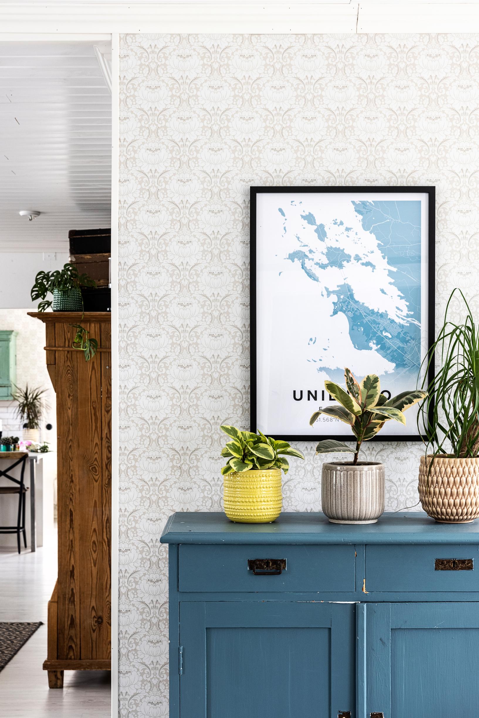 A petrol blue dresser