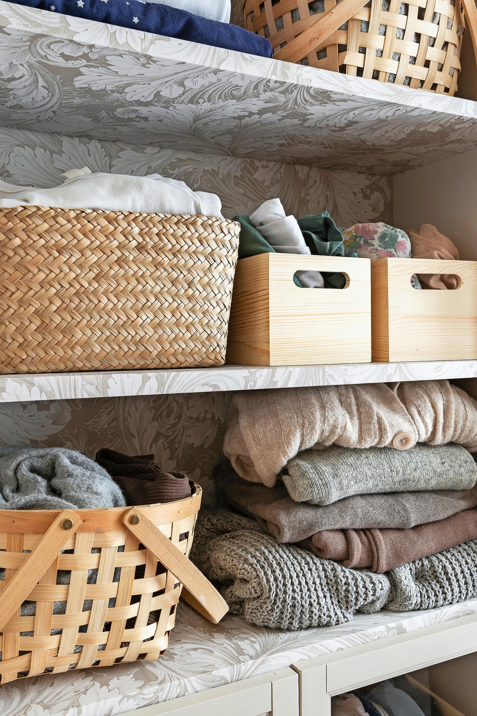 Clothes inside the cabinet.