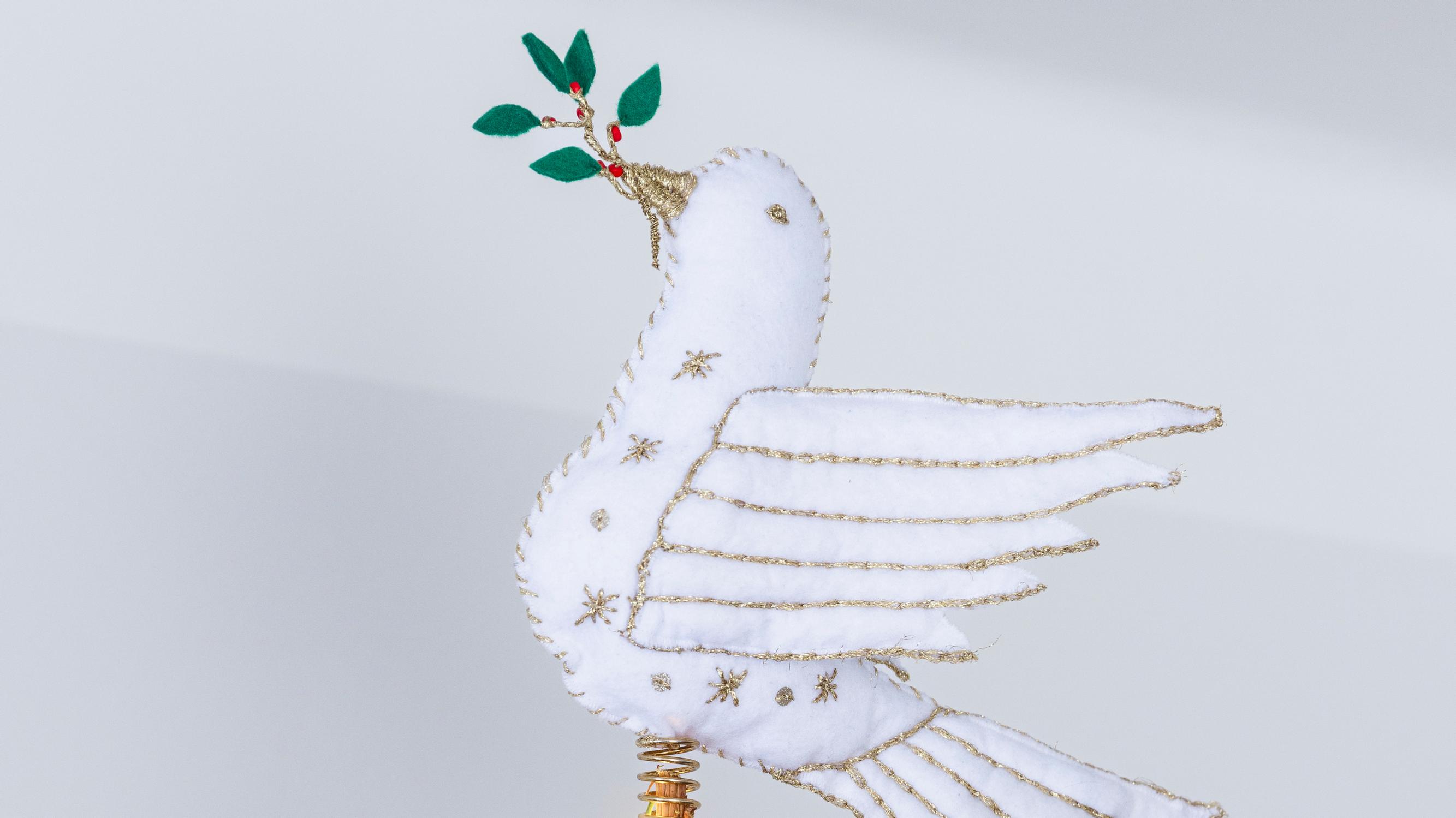 Craft a handmade white dove tree topper that carries a hint of hope