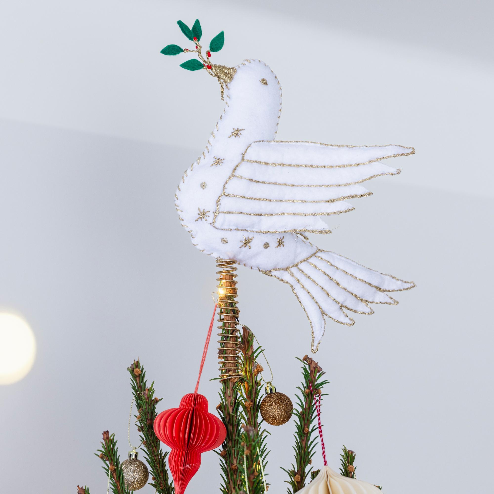Craft a handmade white dove tree topper that carries a hint of hope