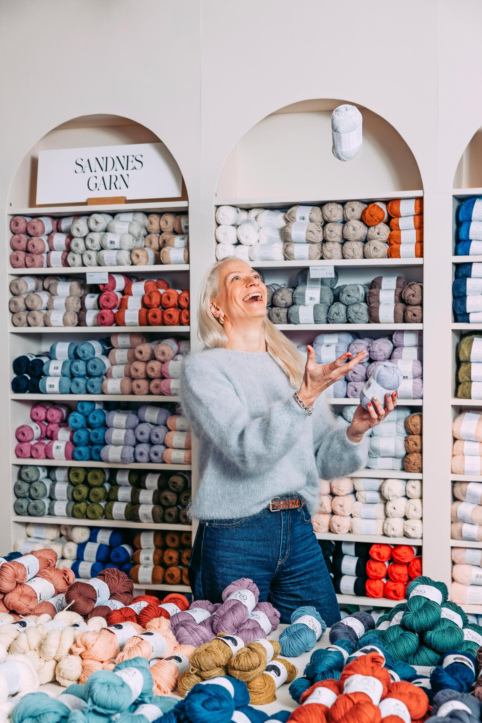 A photo of Linda Permanto in her yarn shop. 