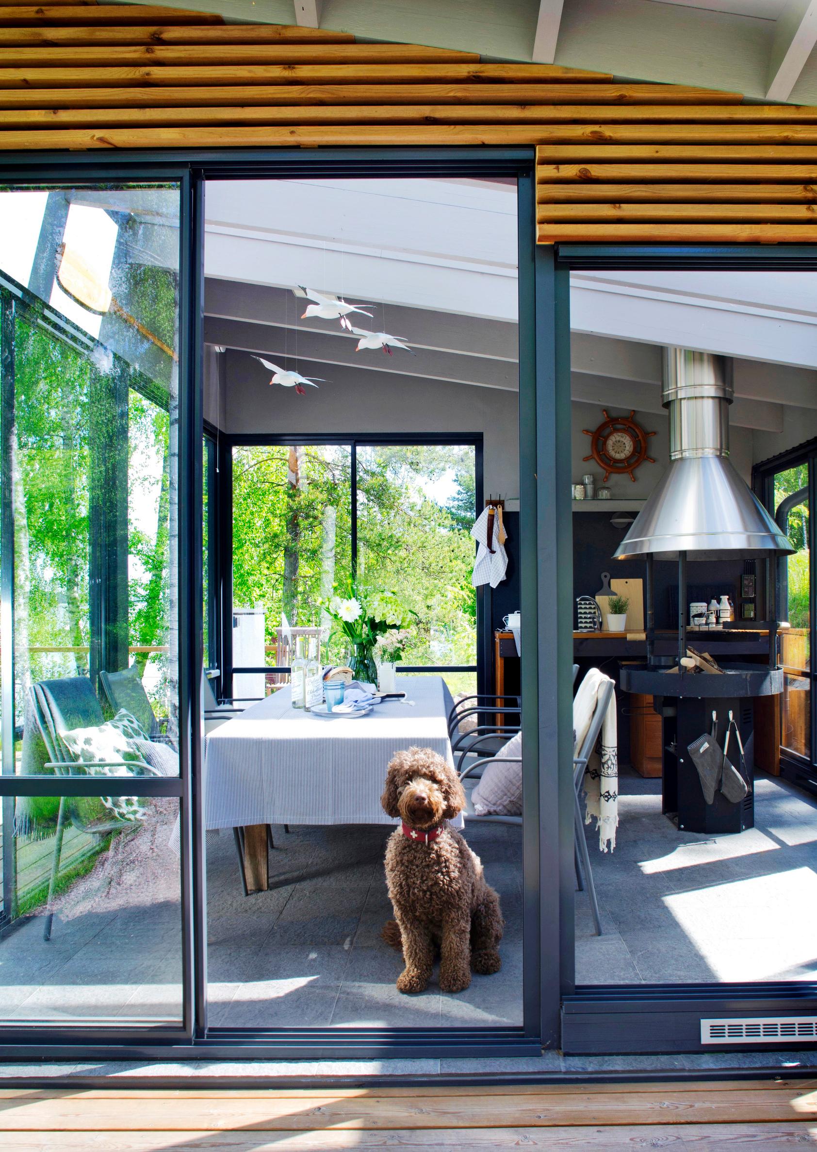 A ready-made summer kitchen with glass walls and sliding doors