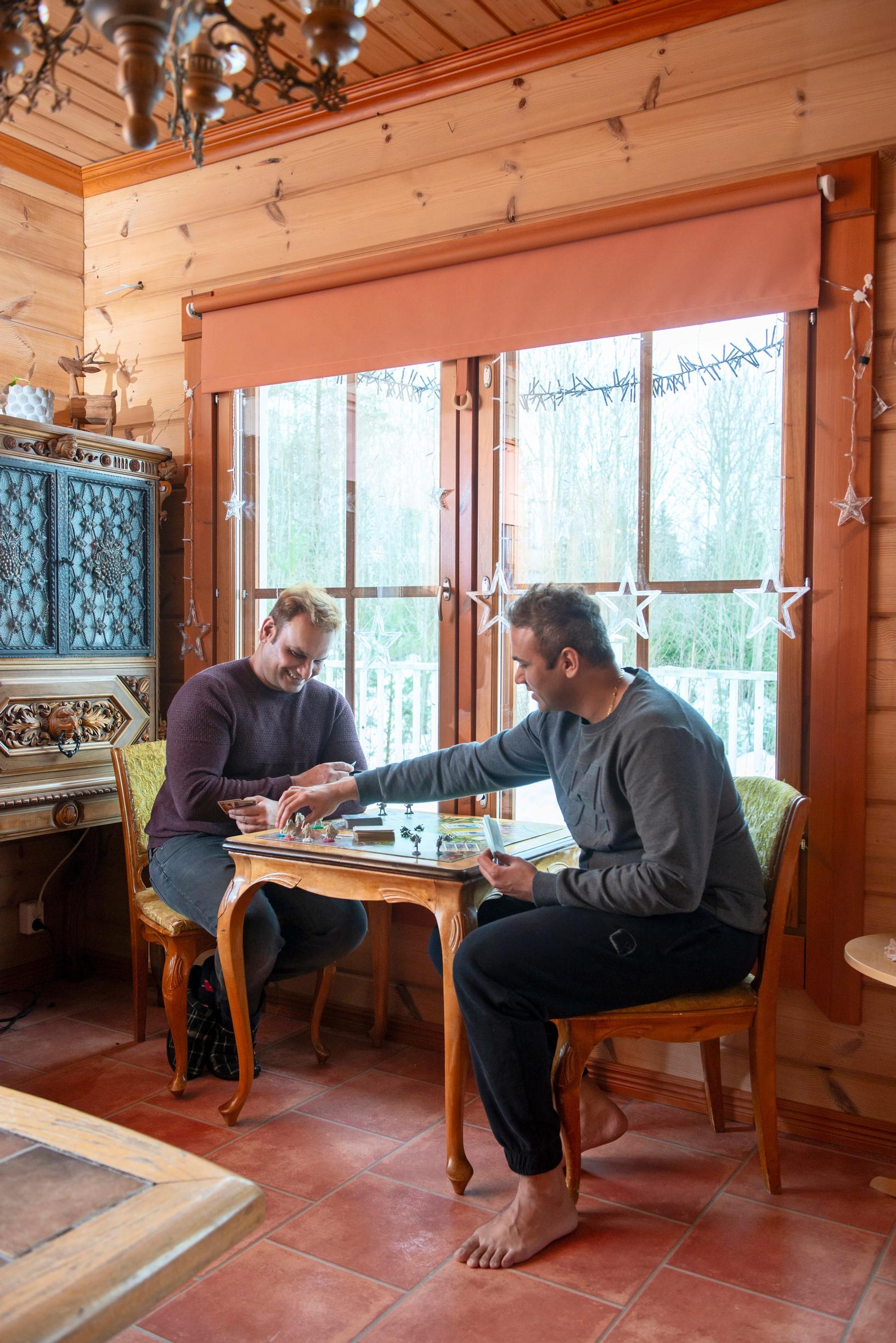 two men sitting at a table