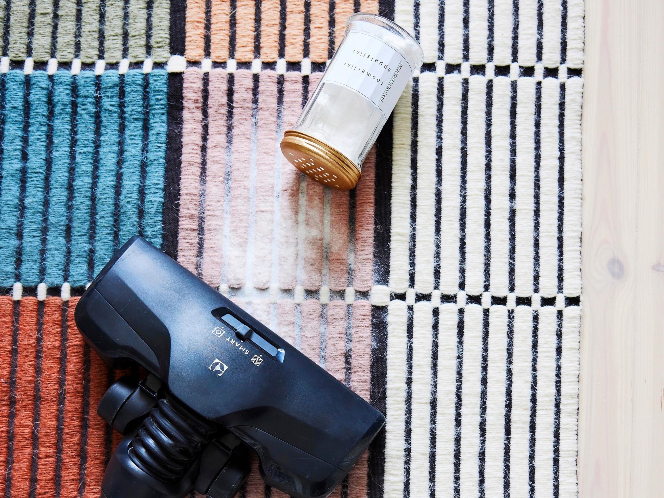 Freshen carpets and textiles with homemade vacuuming powder—all you need is baking soda and essential oil