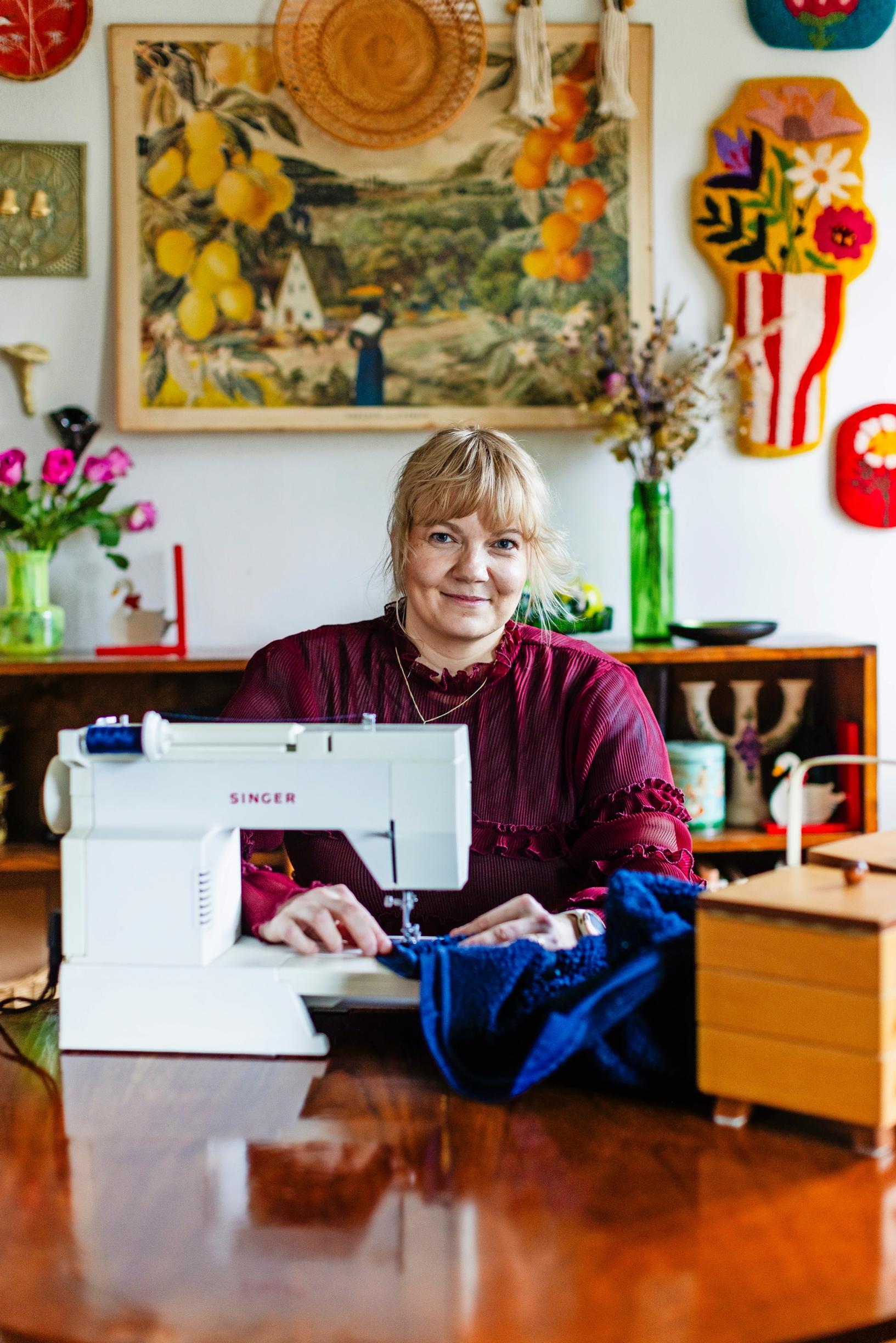 Suvi at her sewing machine.
