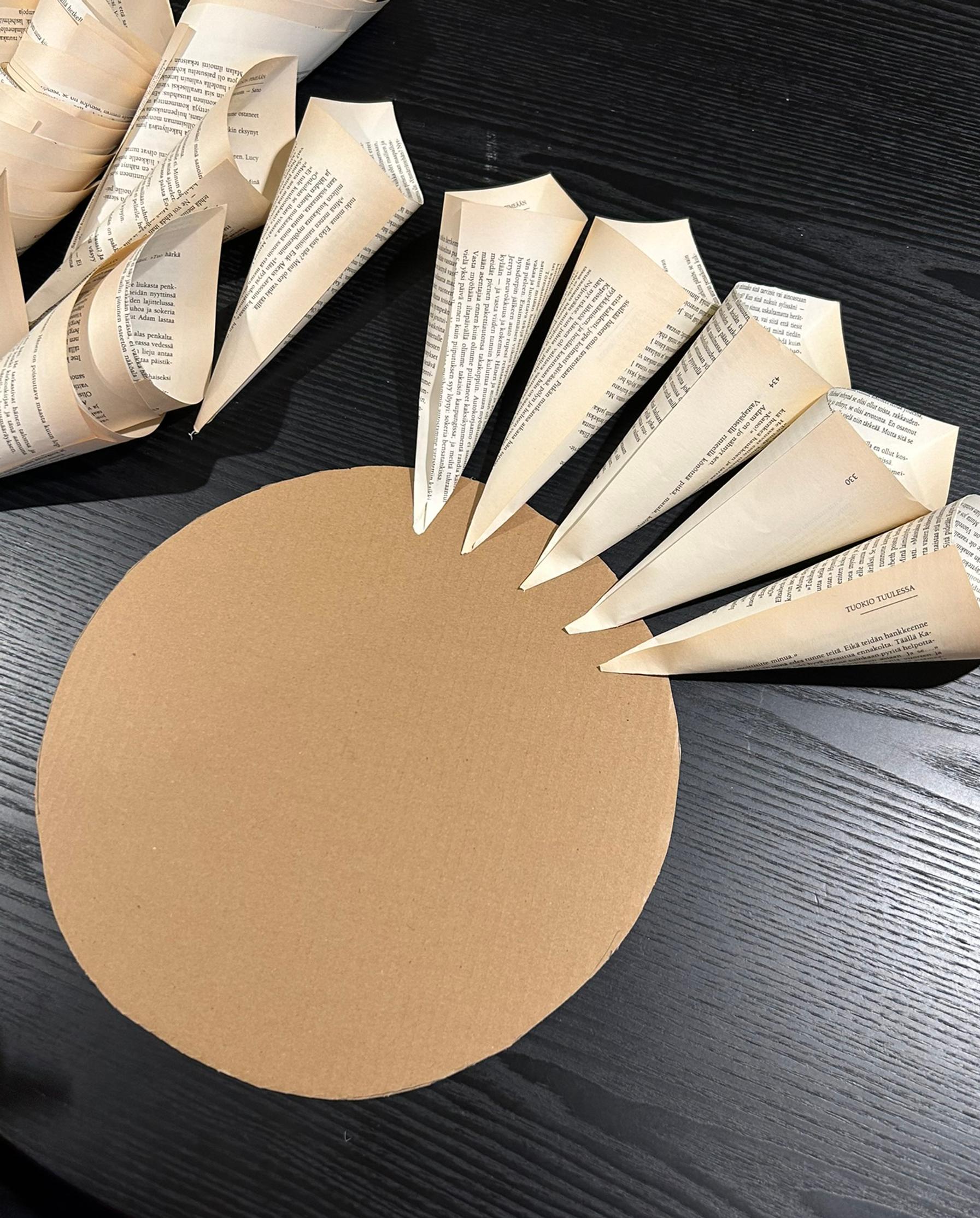 Attaching the paper cones to the cardboard base