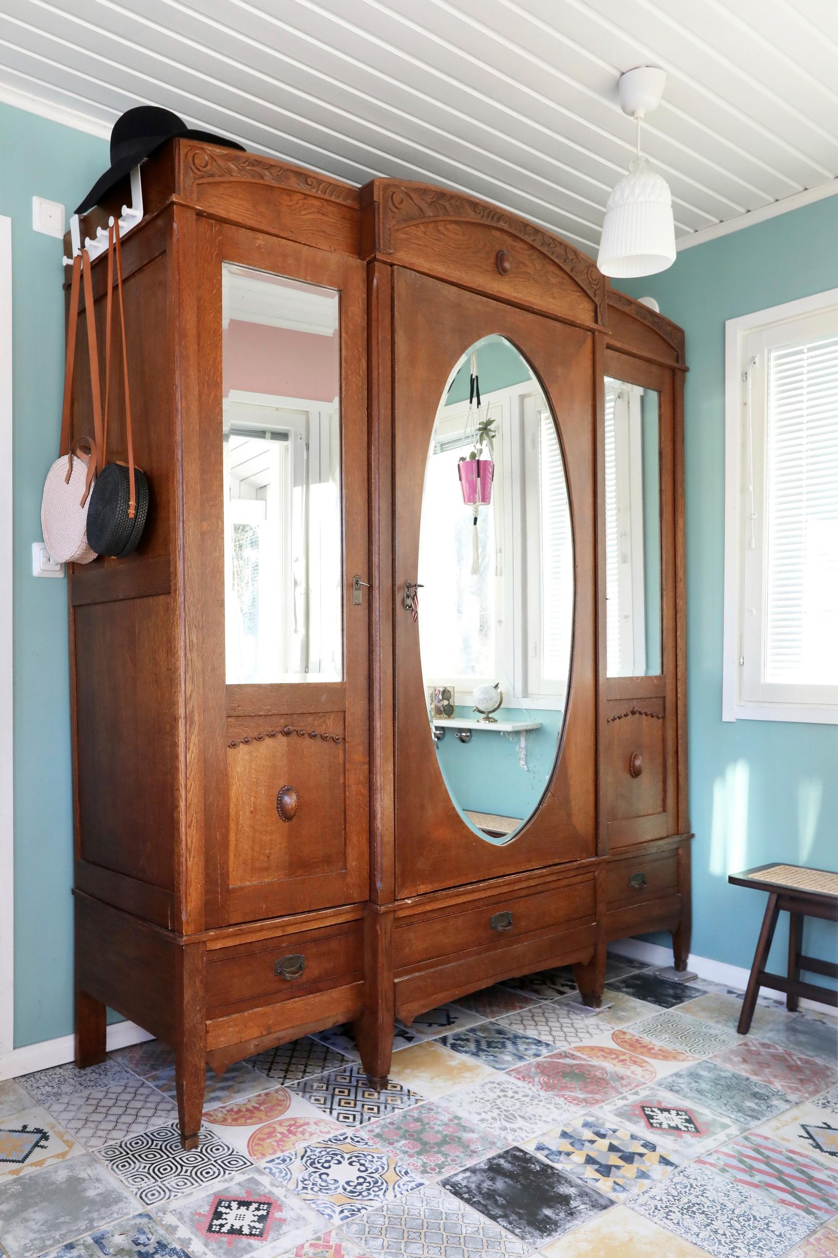 An old, large antique cabinet in the entryway.