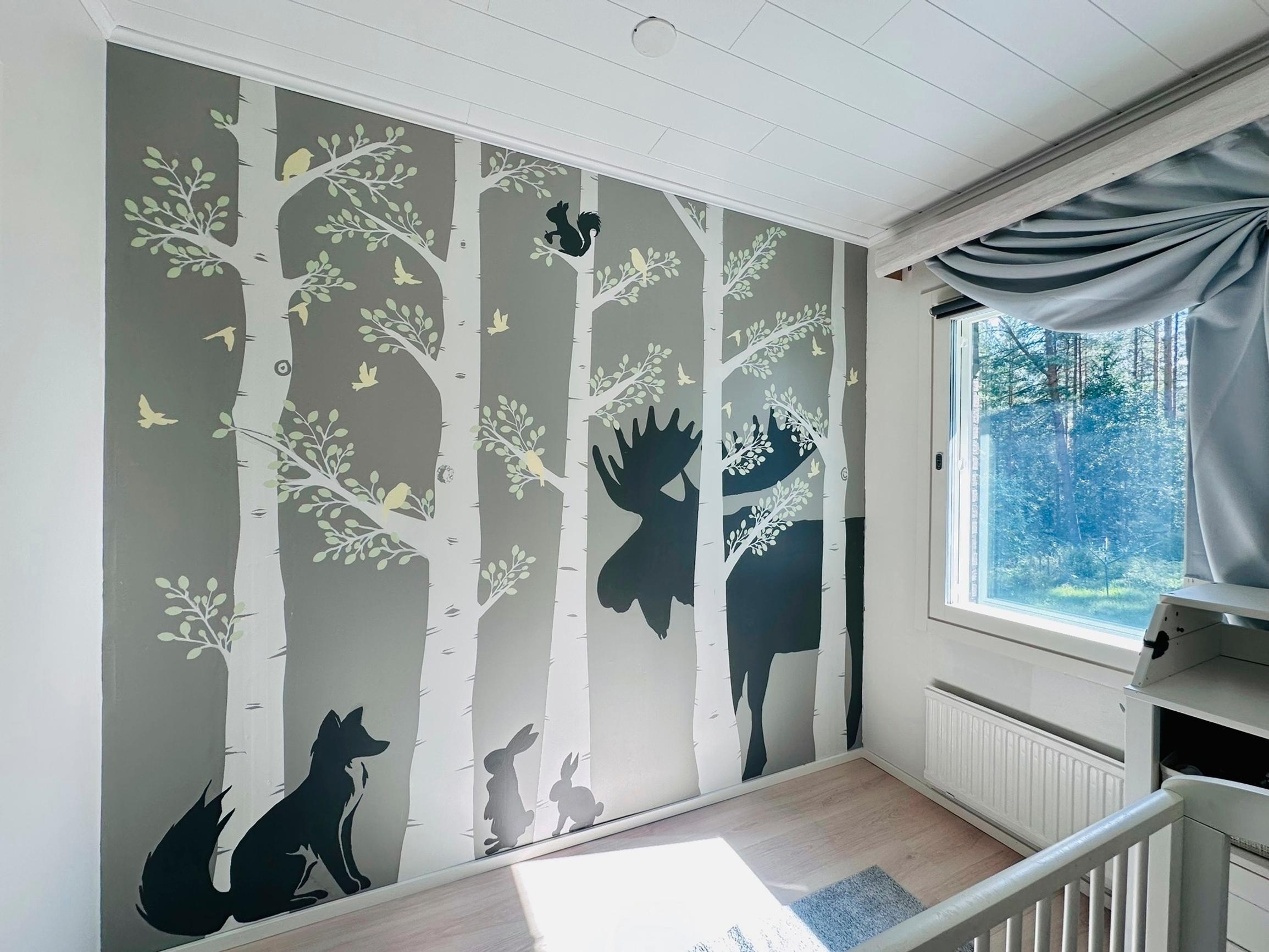 In place of shelves, there’s a painting featuring a fox, squirrels, birds, rabbits, and a moose.