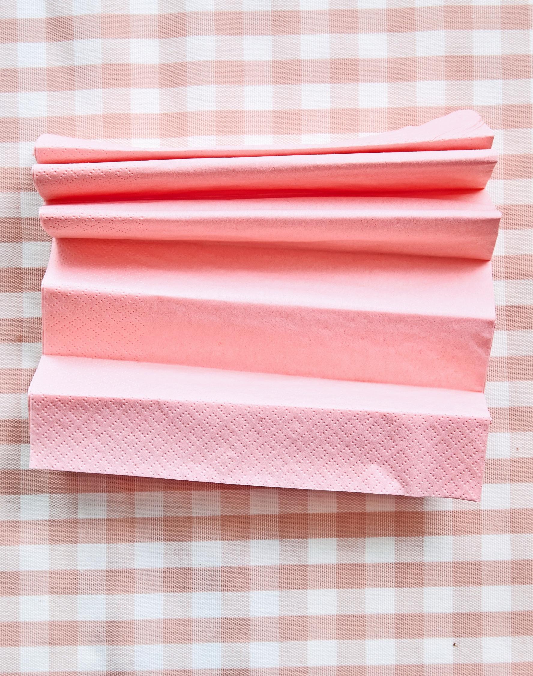 The napkins have been folded into an accordion shape.