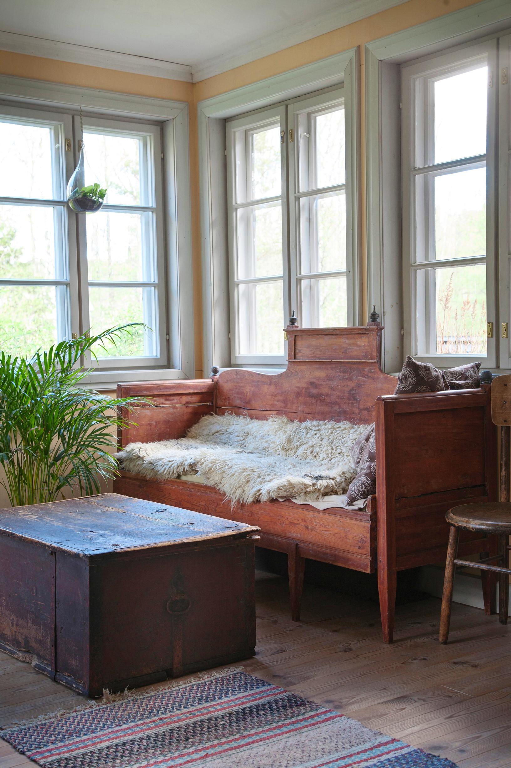 The living room's wooden sofa and trunk.