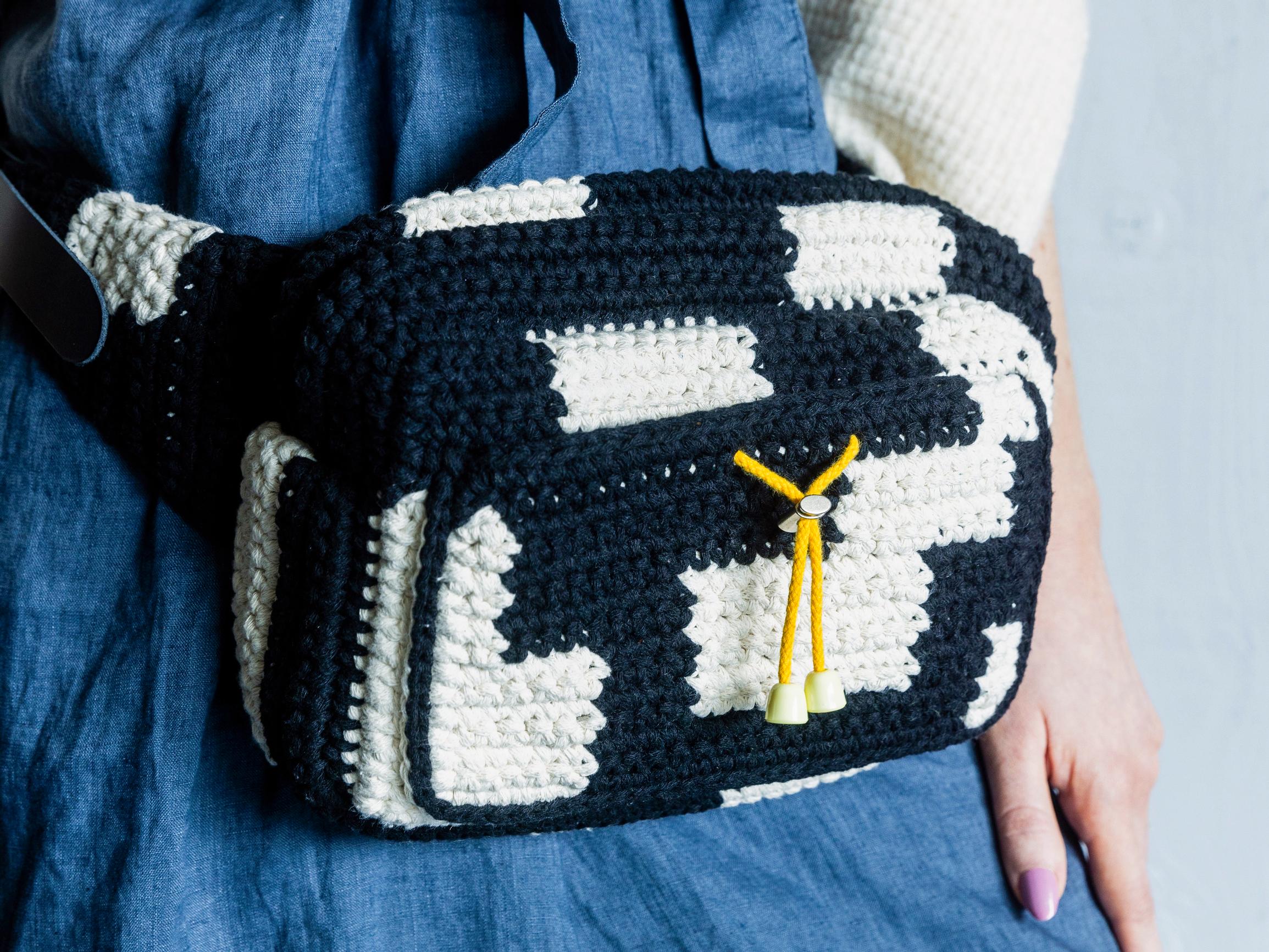 Crochet this roomy belt bag with pattern by Molla Mills—the two-color bag is easy to assemble from pieces