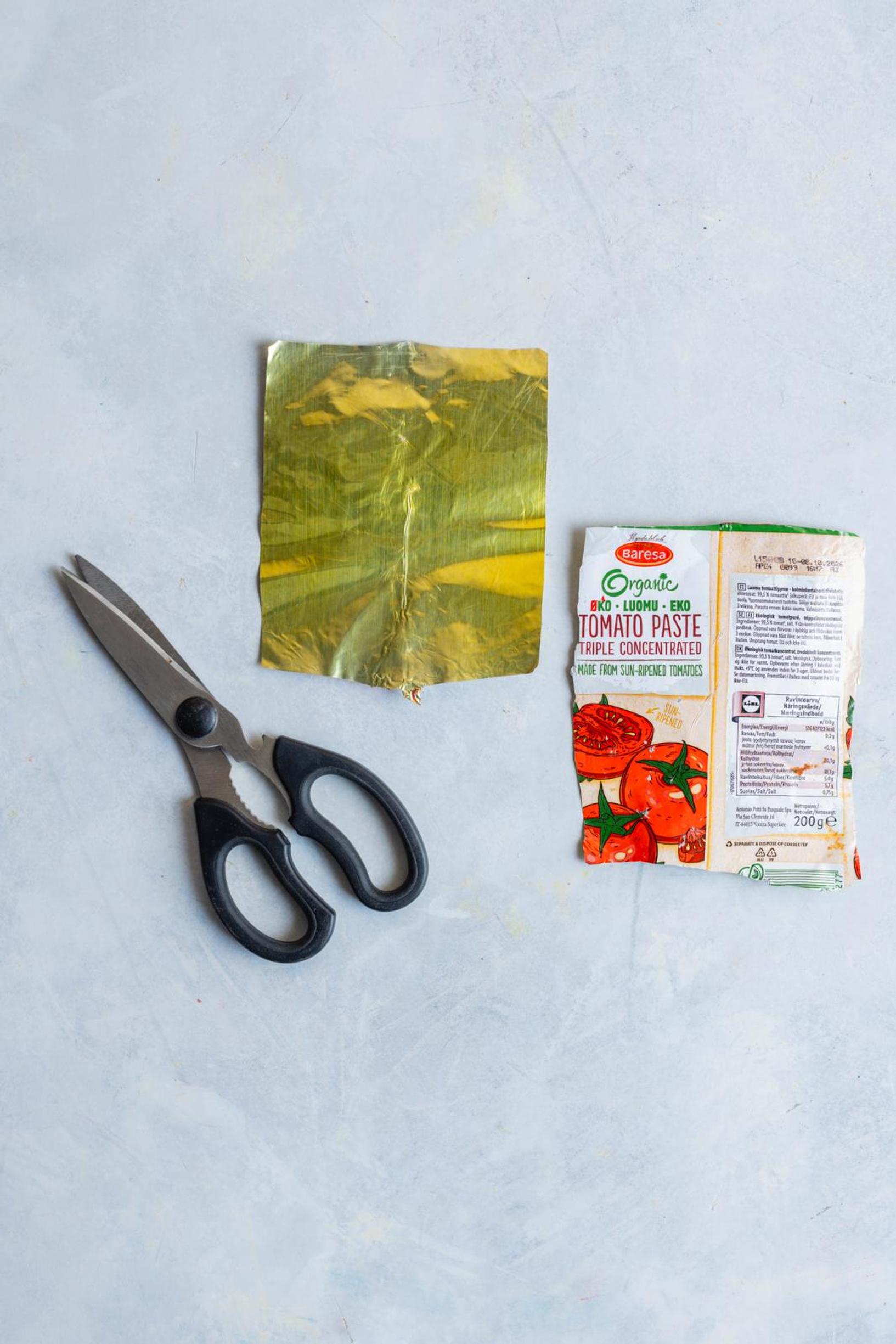 The tomato paste tube, cut open and cleaned.