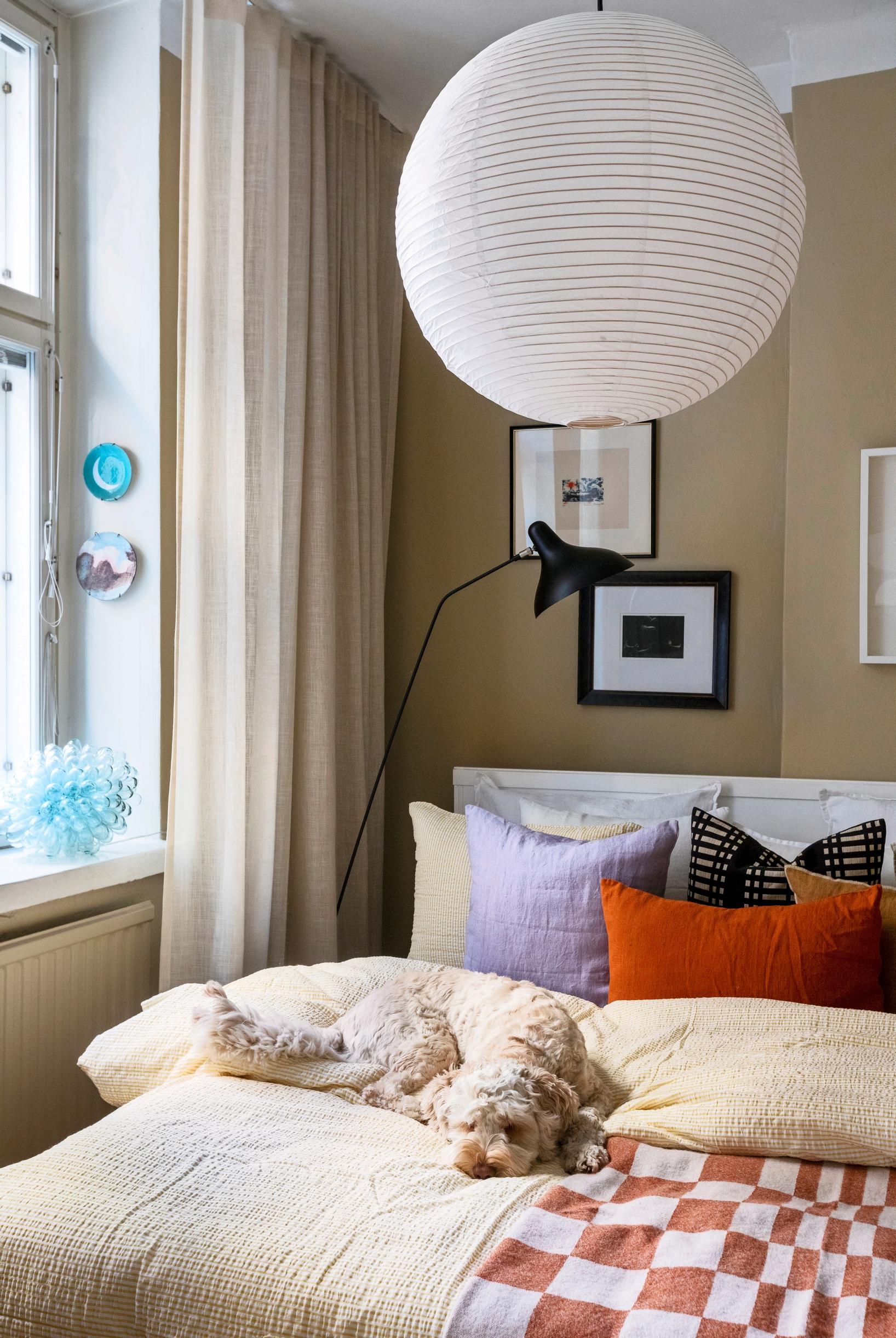 Plush bedding and a checkered blanket in the bedroom