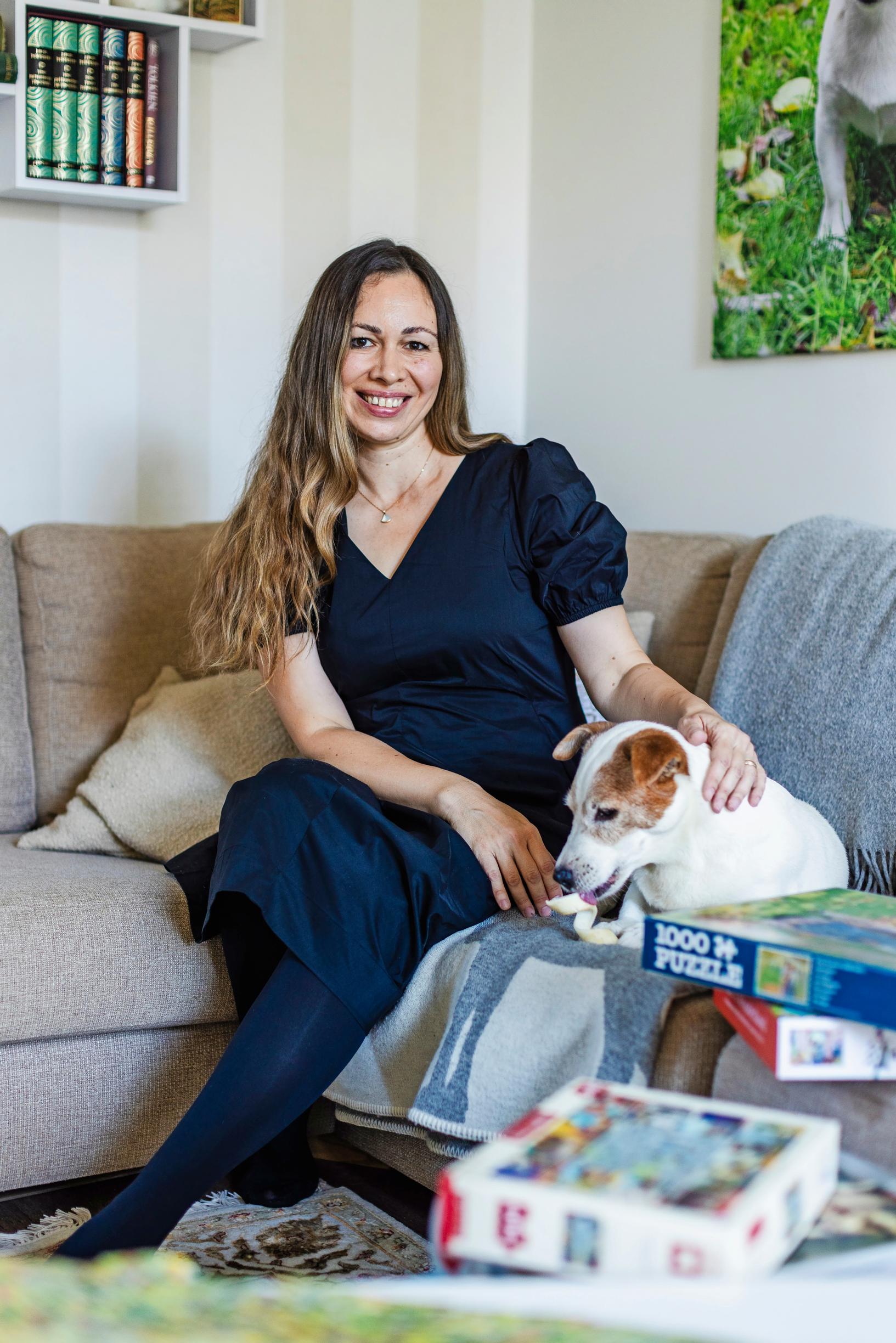 Photo of puzzle enthusiast Kira Rainvuori with her Jack Russell Terrier.