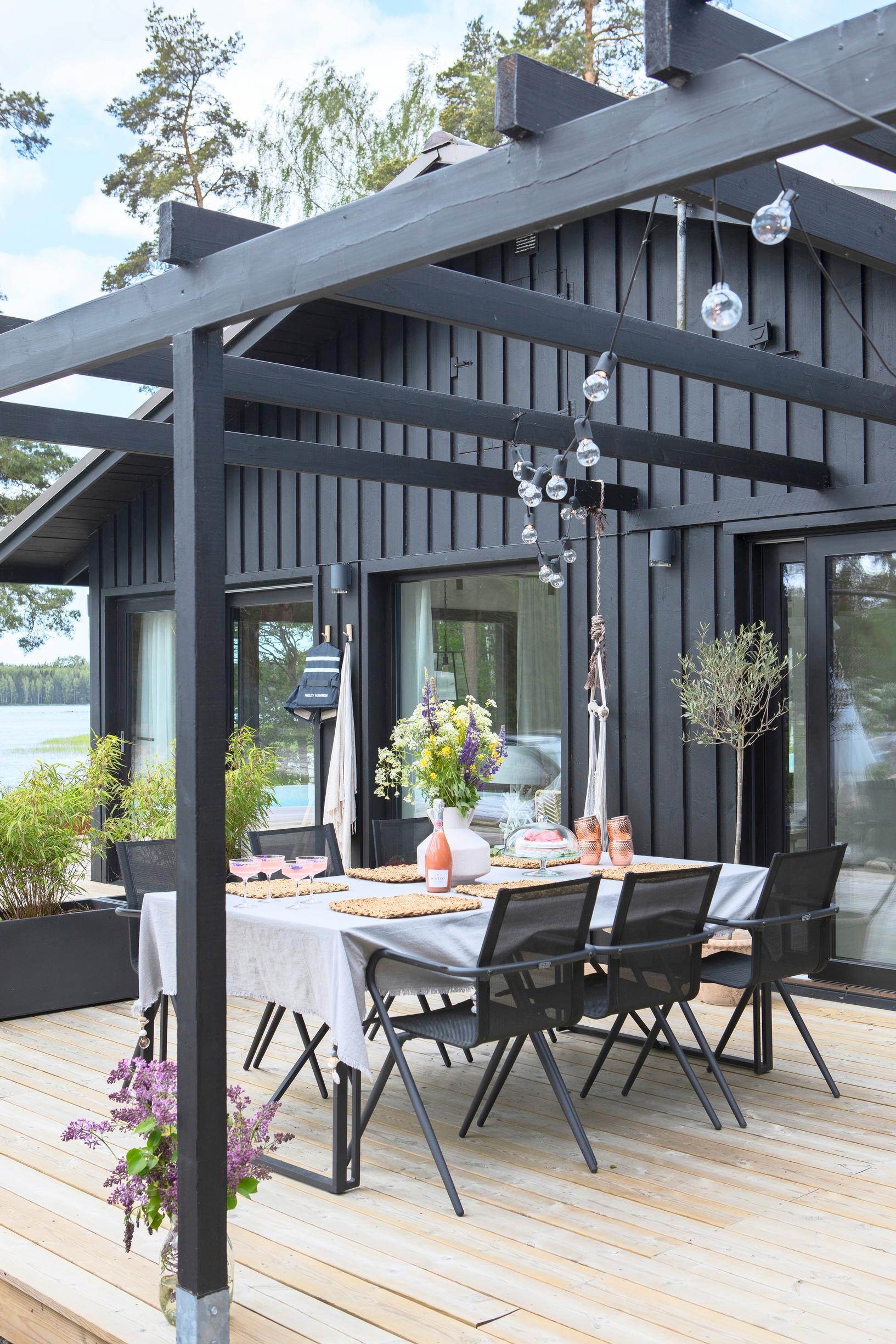A modern dining set under the pergola