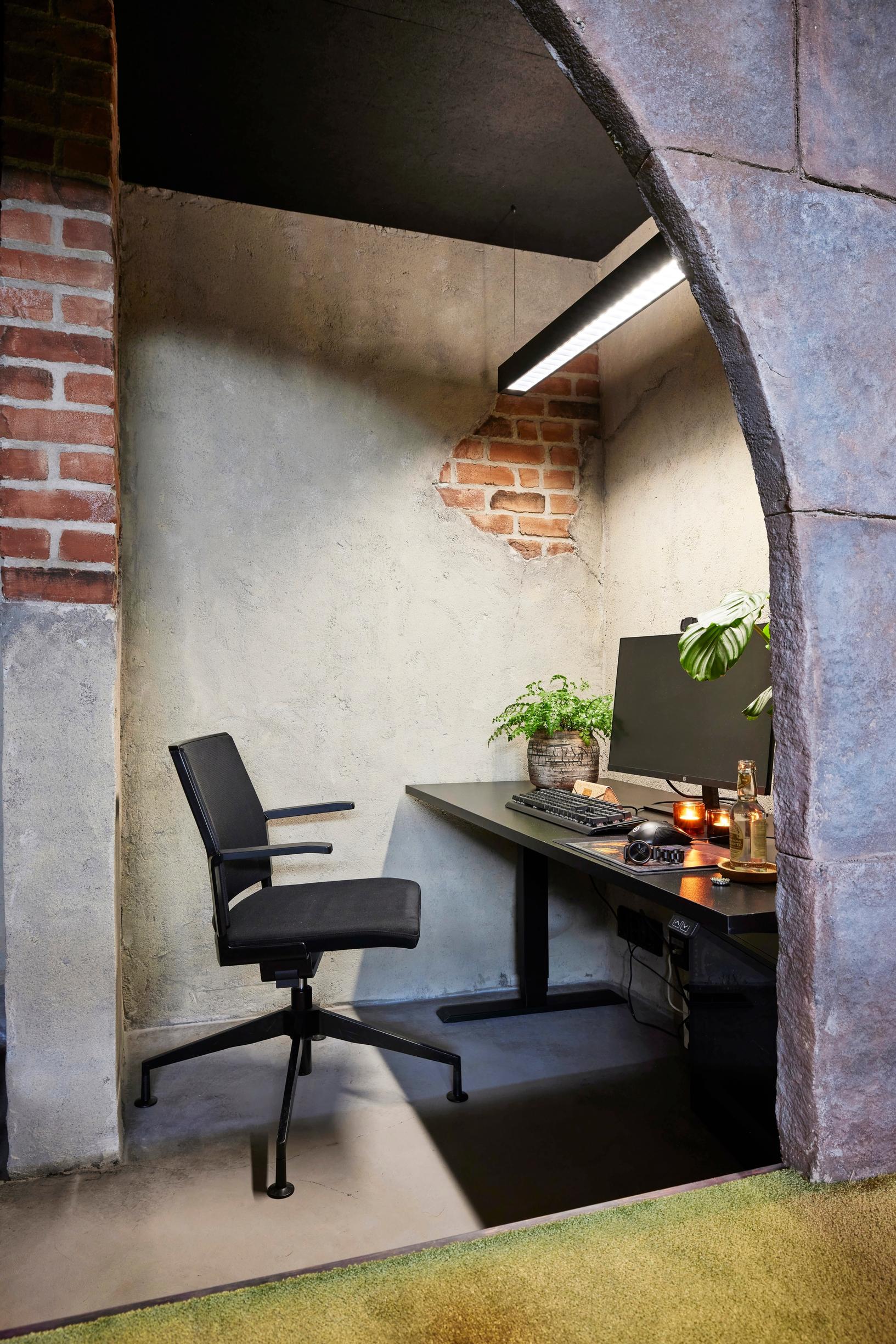 Workstation behind the arched doorway