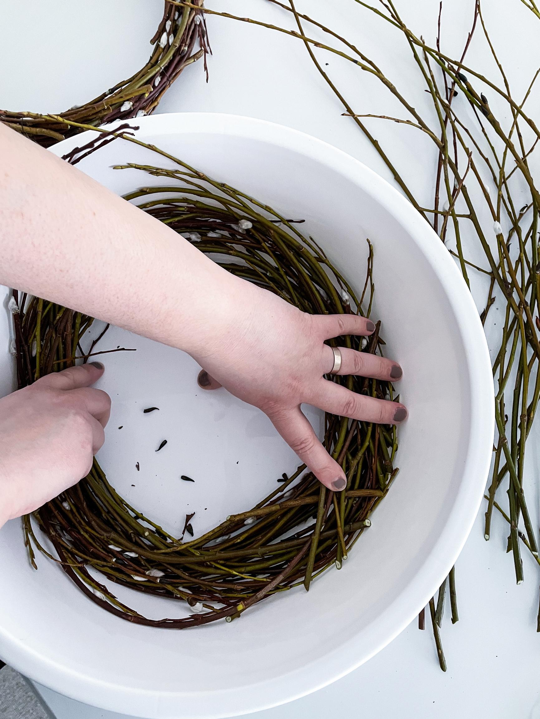 Shaping the willow wreath in a washing bowl