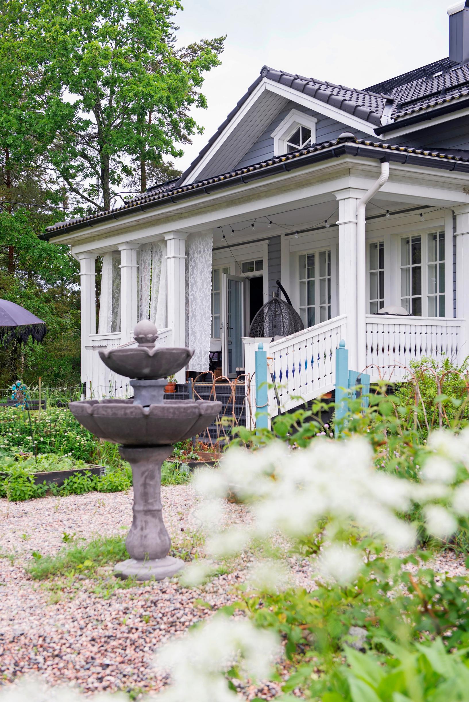 gray wooden house and garden