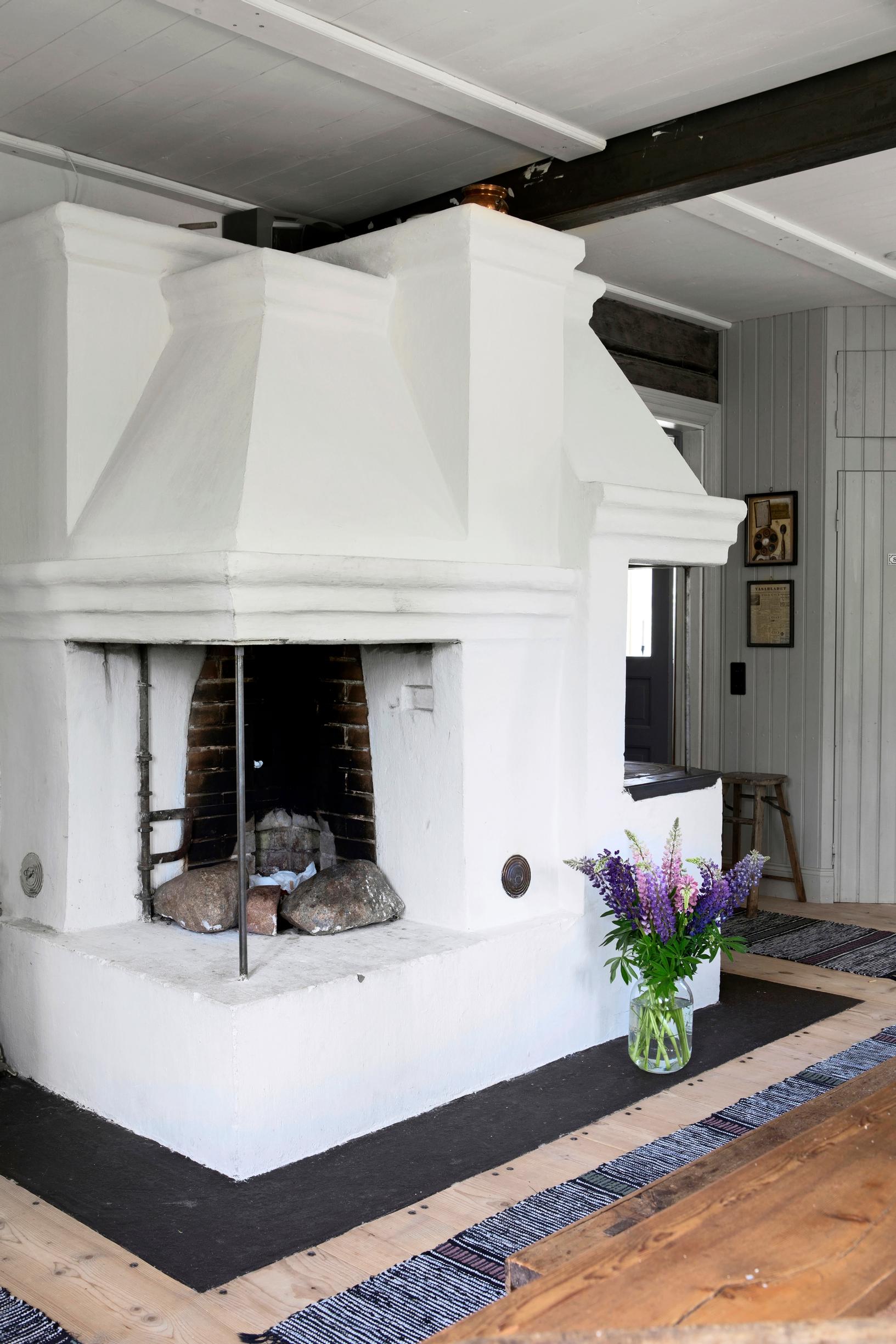 A white plastered open fireplace