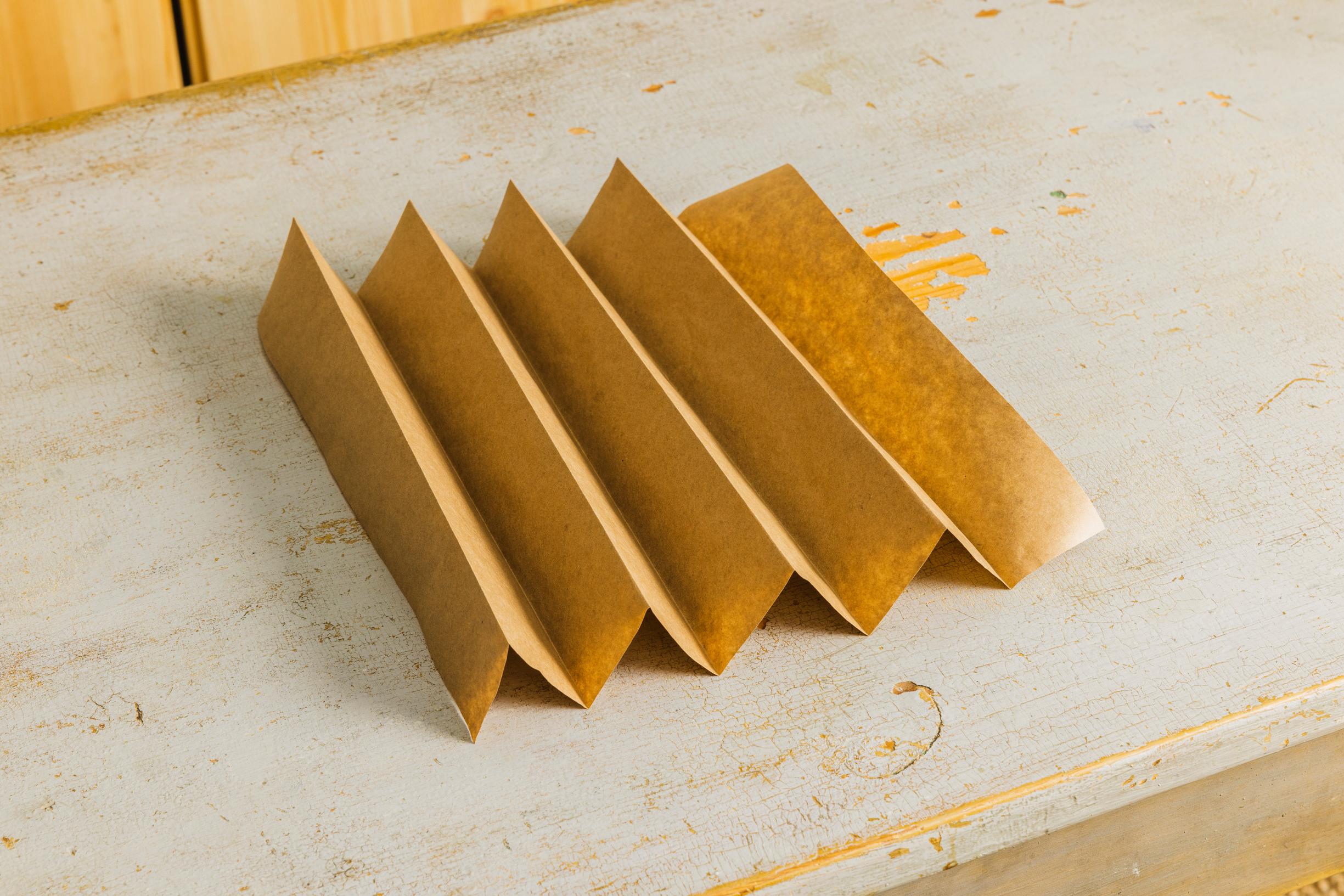 Layered star step 1: a wide accordion folded from kraft paper.