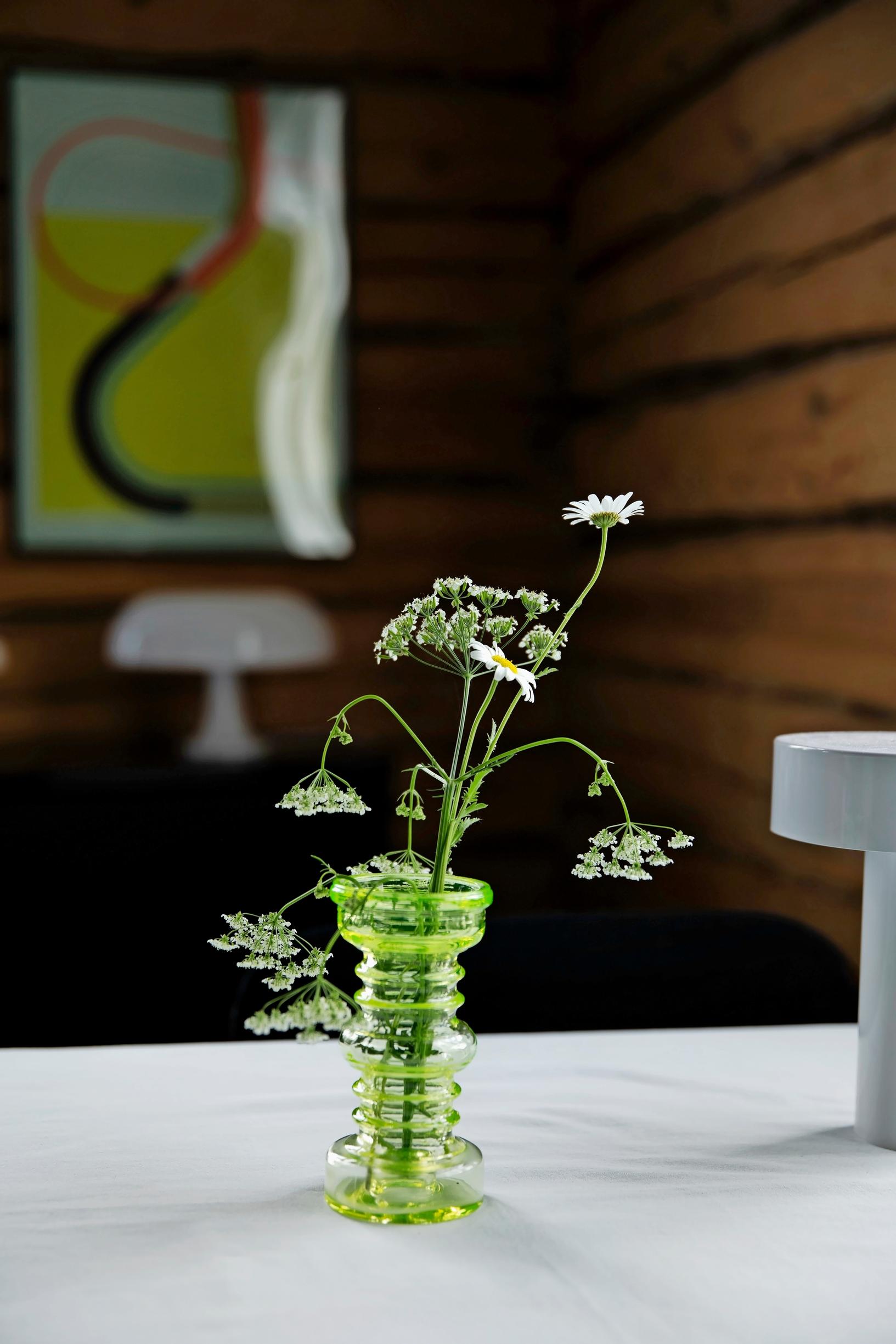 A flower vase on the table.