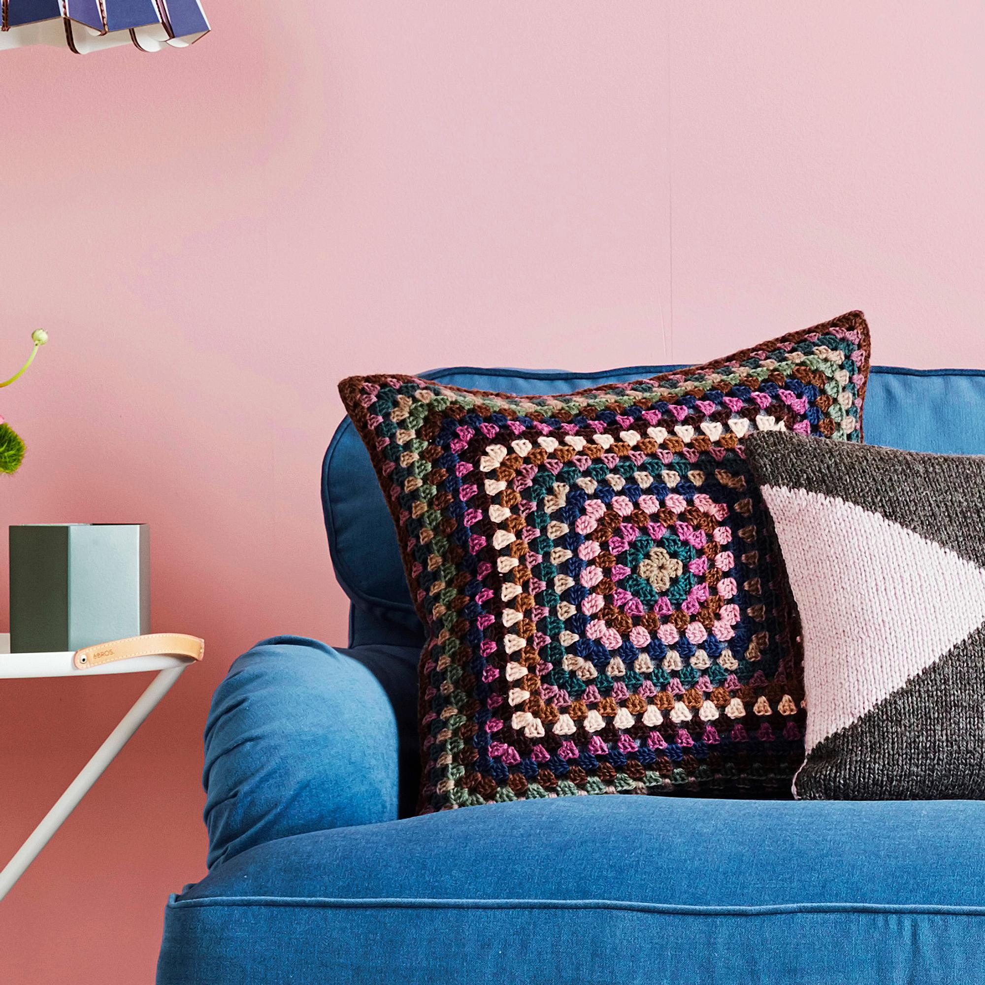 Granny square pillow—crochet a giant granny square from leftover yarn and sew it onto a ready-made pillow cover