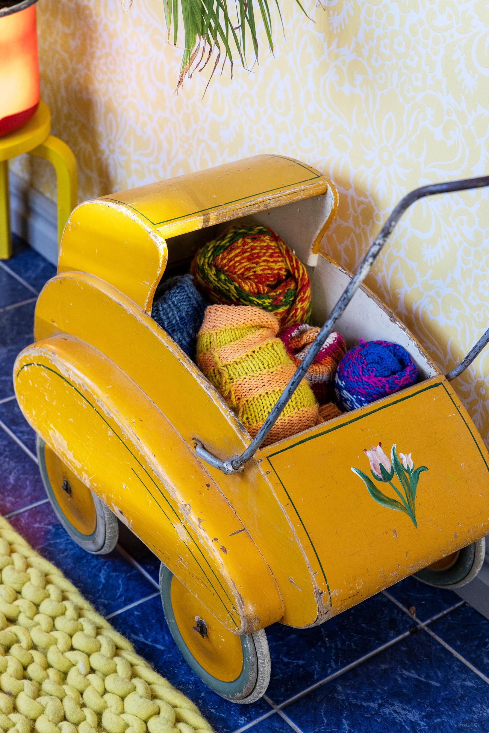 Yellow doll carriage.