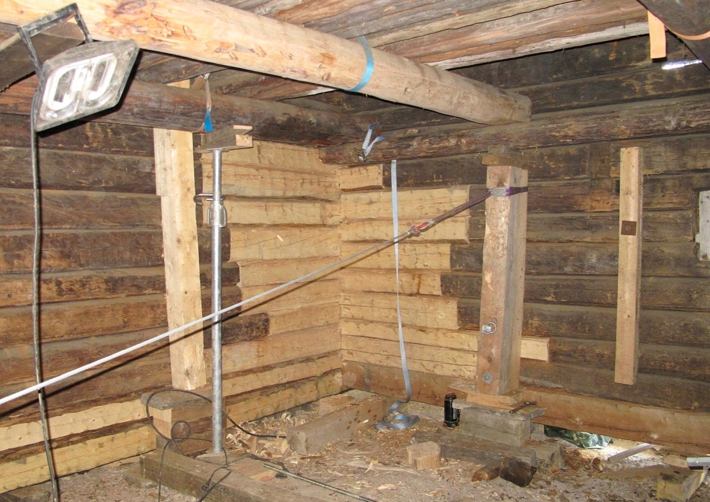 Cowshed log repair site interior