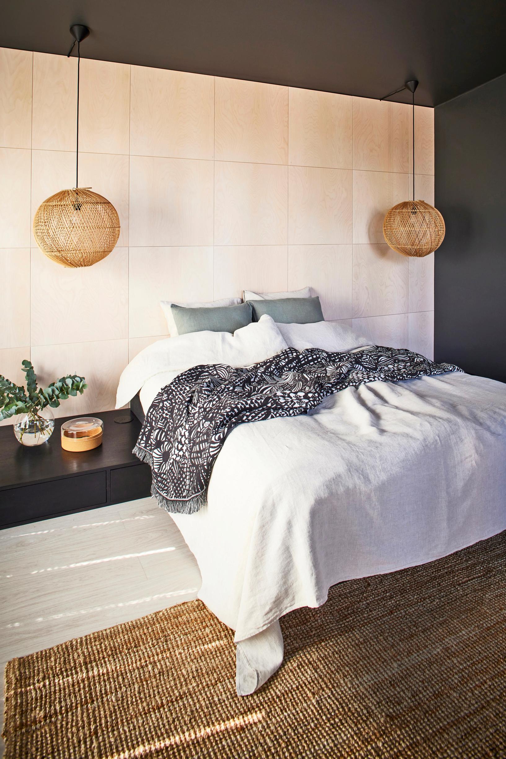 Birch paneling was installed on the bedroom wall.