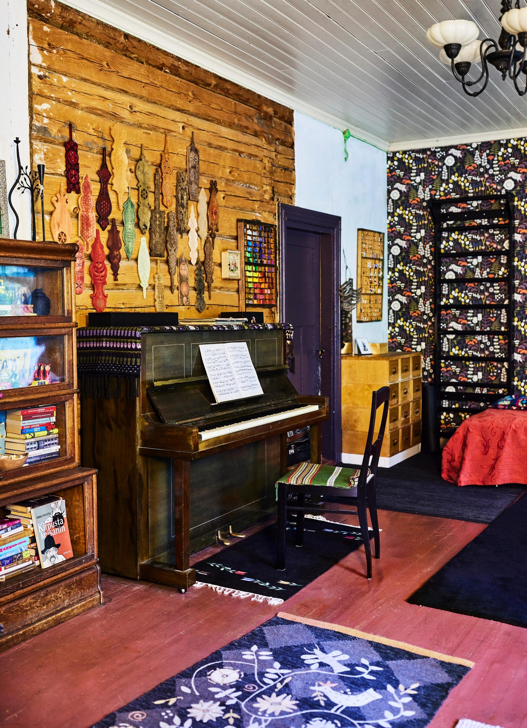 Piano in front of a log wall