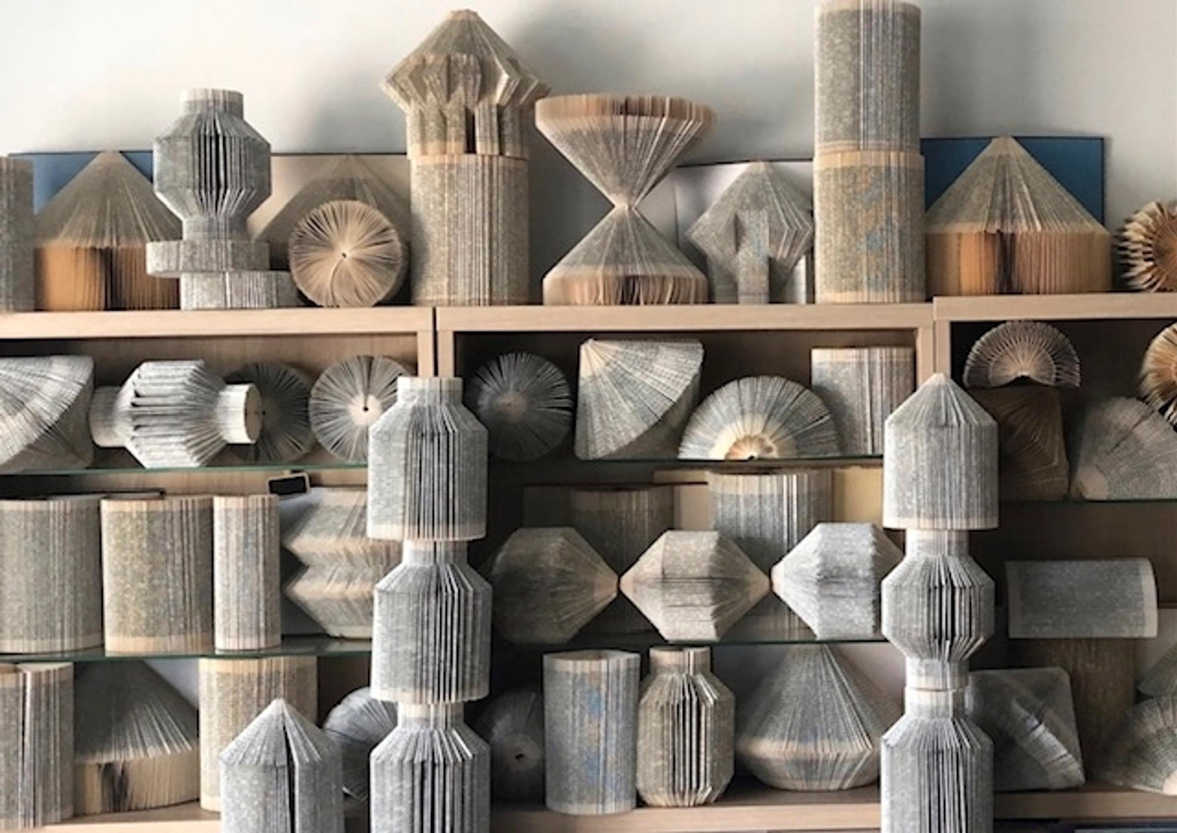 folded books on a shelf