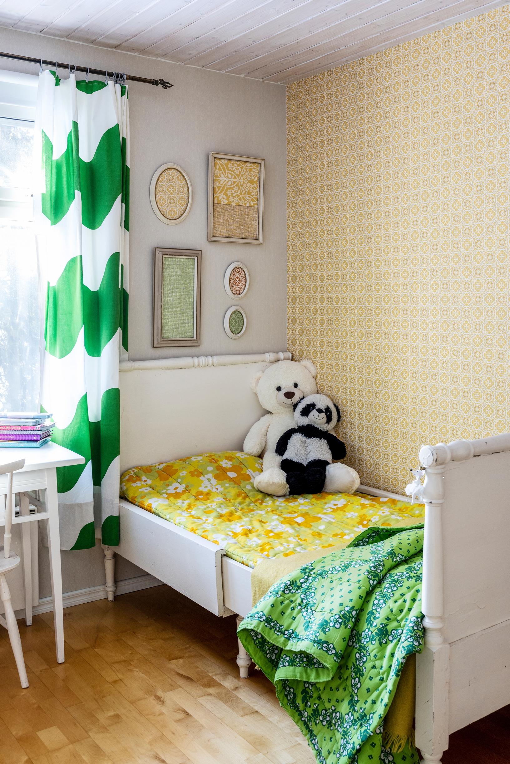 A 100-year-old wooden bed in a child’s room.