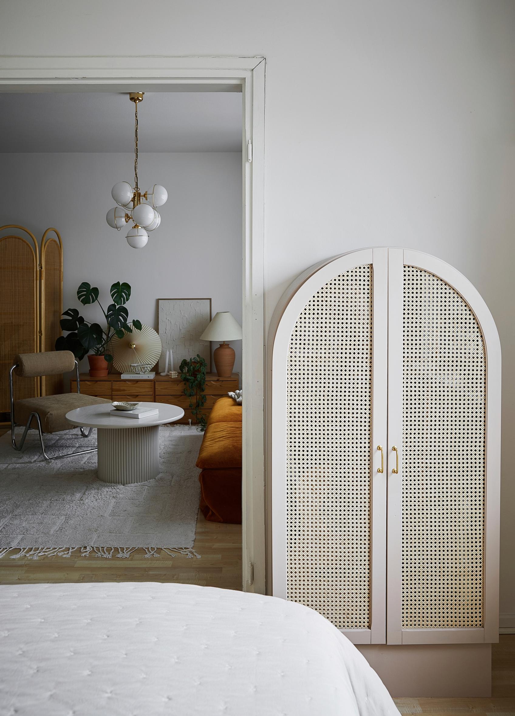 A curved cabinet refreshed with rattan mesh and paint