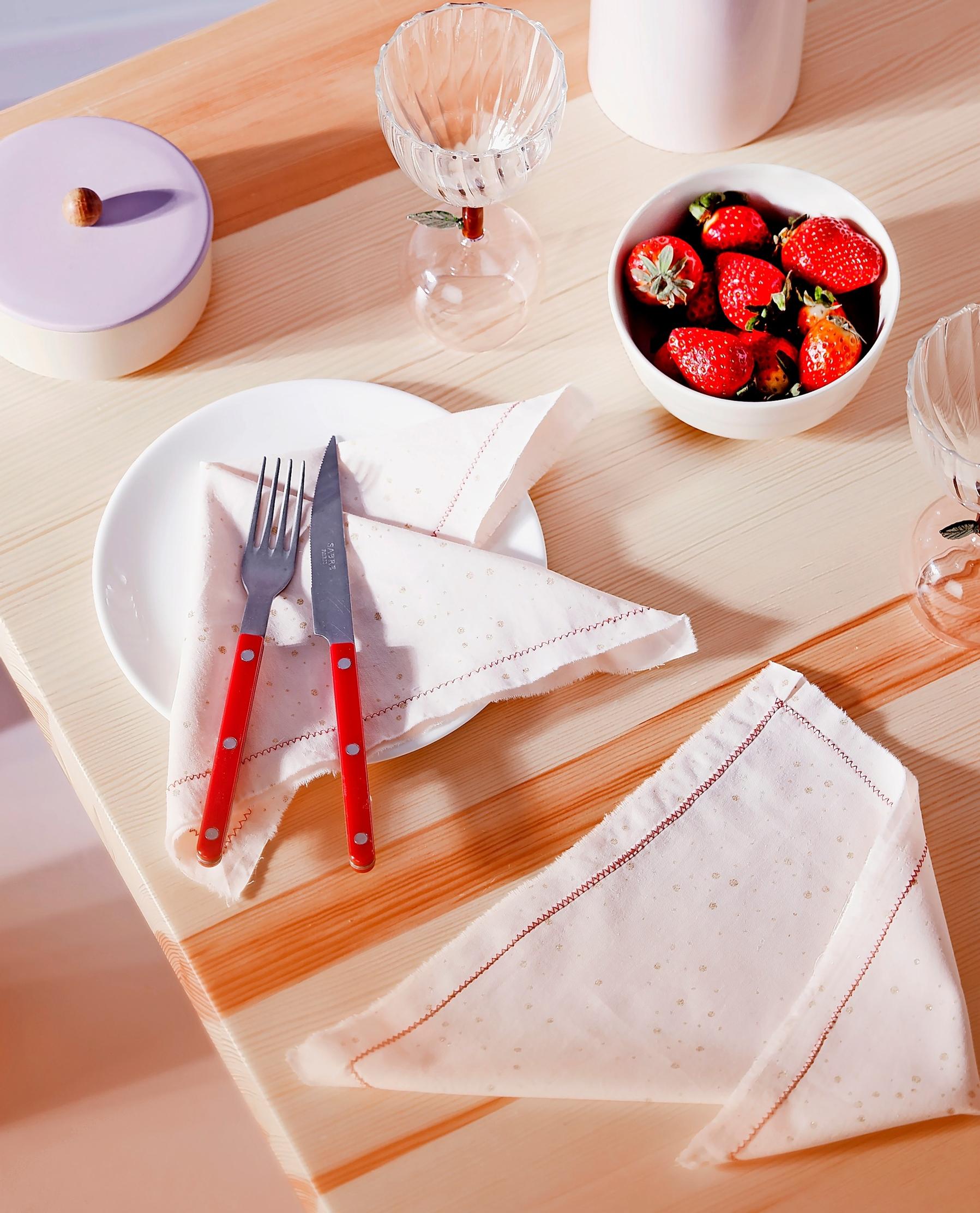 Zigzag-edged napkins on the table.