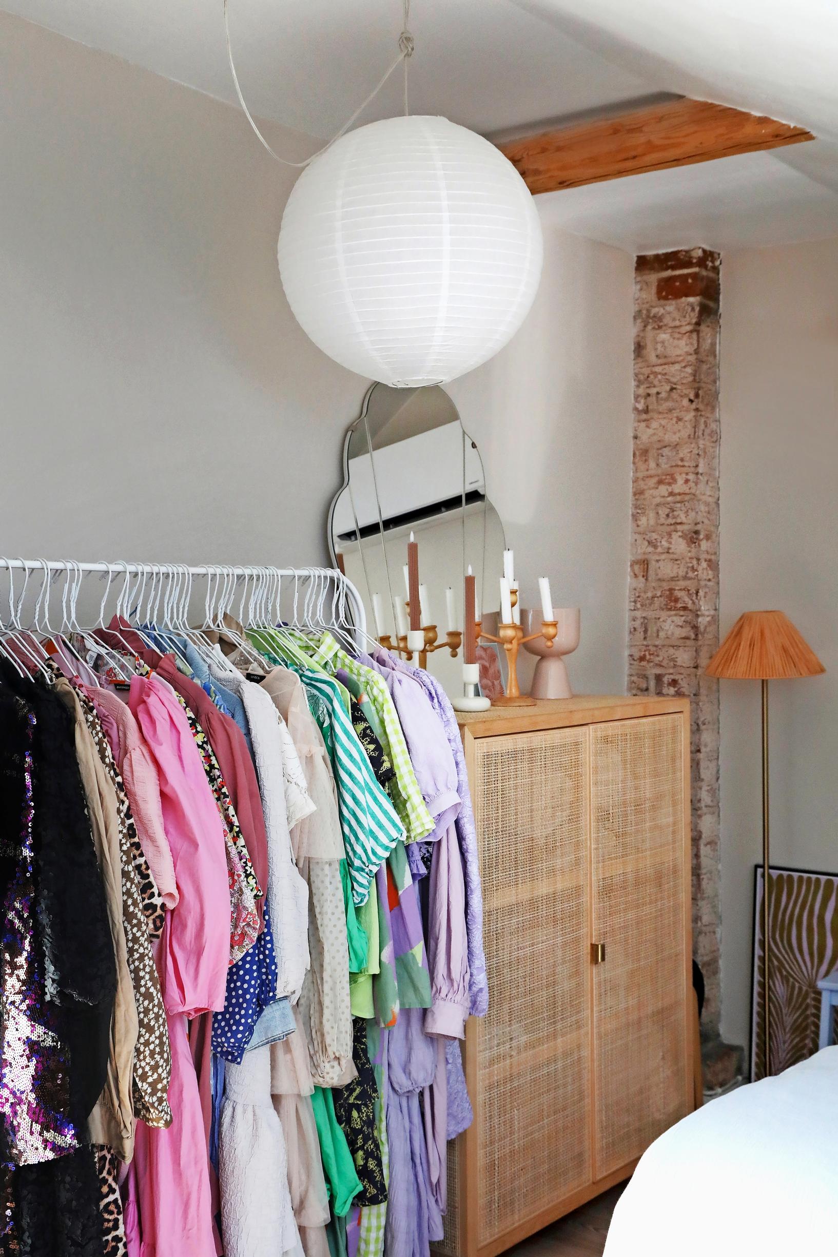 dress collection on a bedroom rack