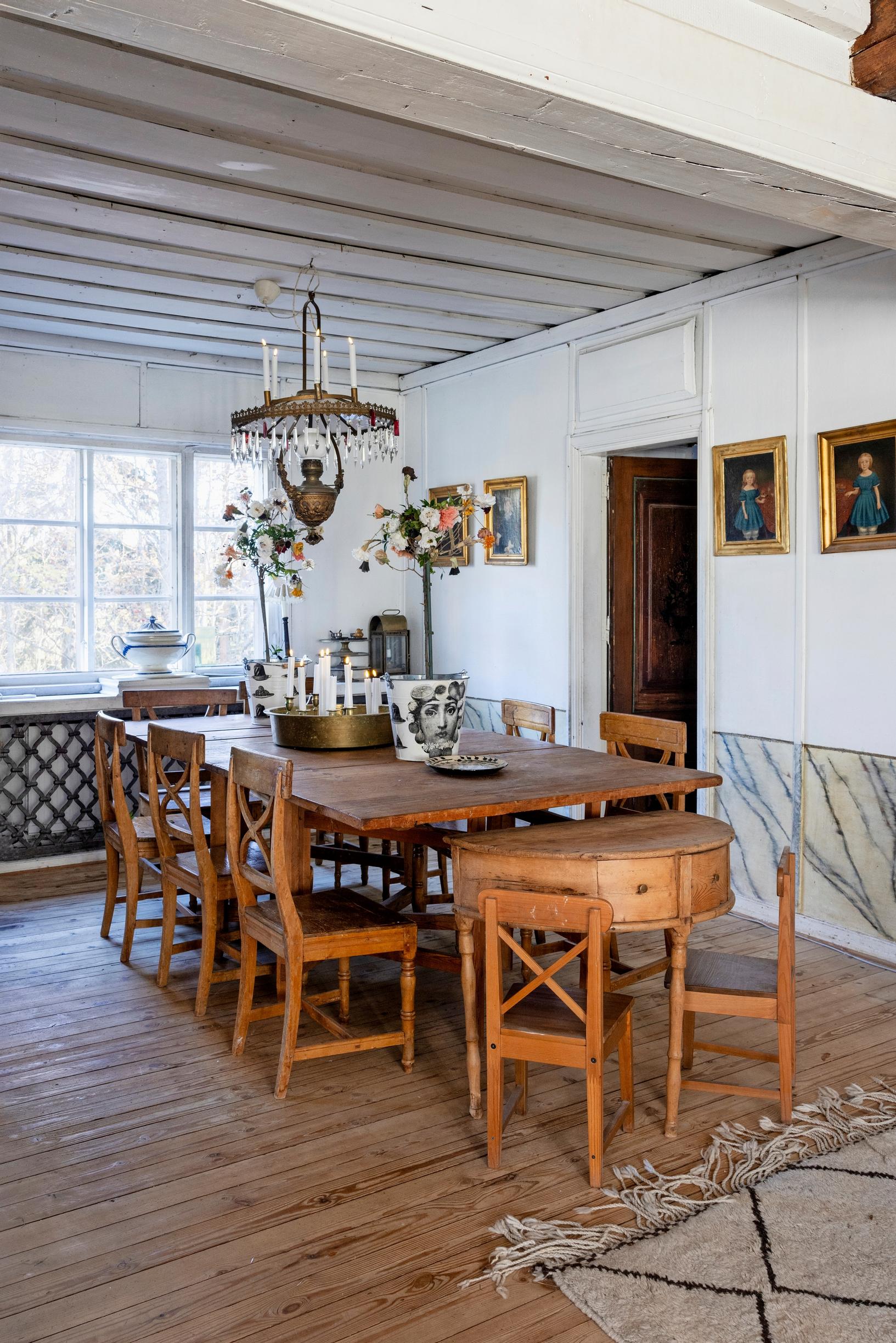 Dining area with old wooden antique chairs and a table.