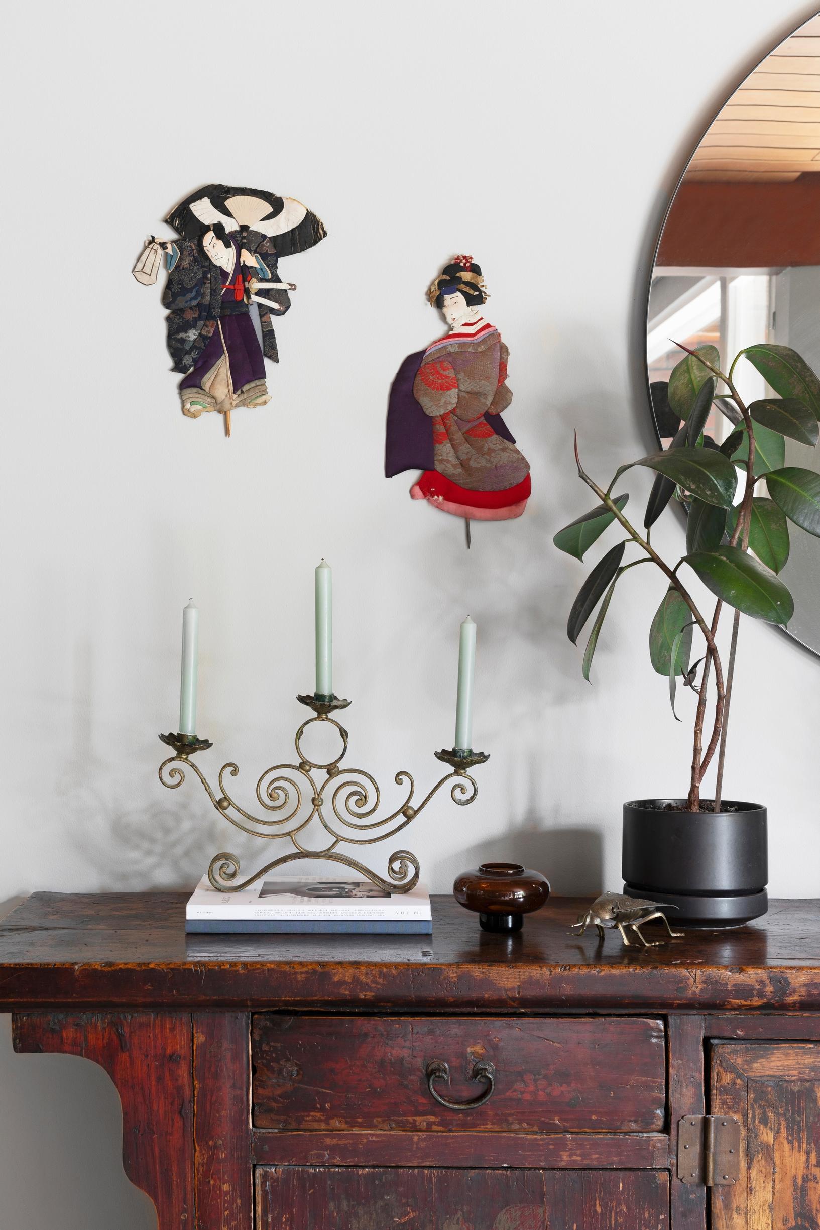 Travel souvenirs on and above the Chinese sideboard