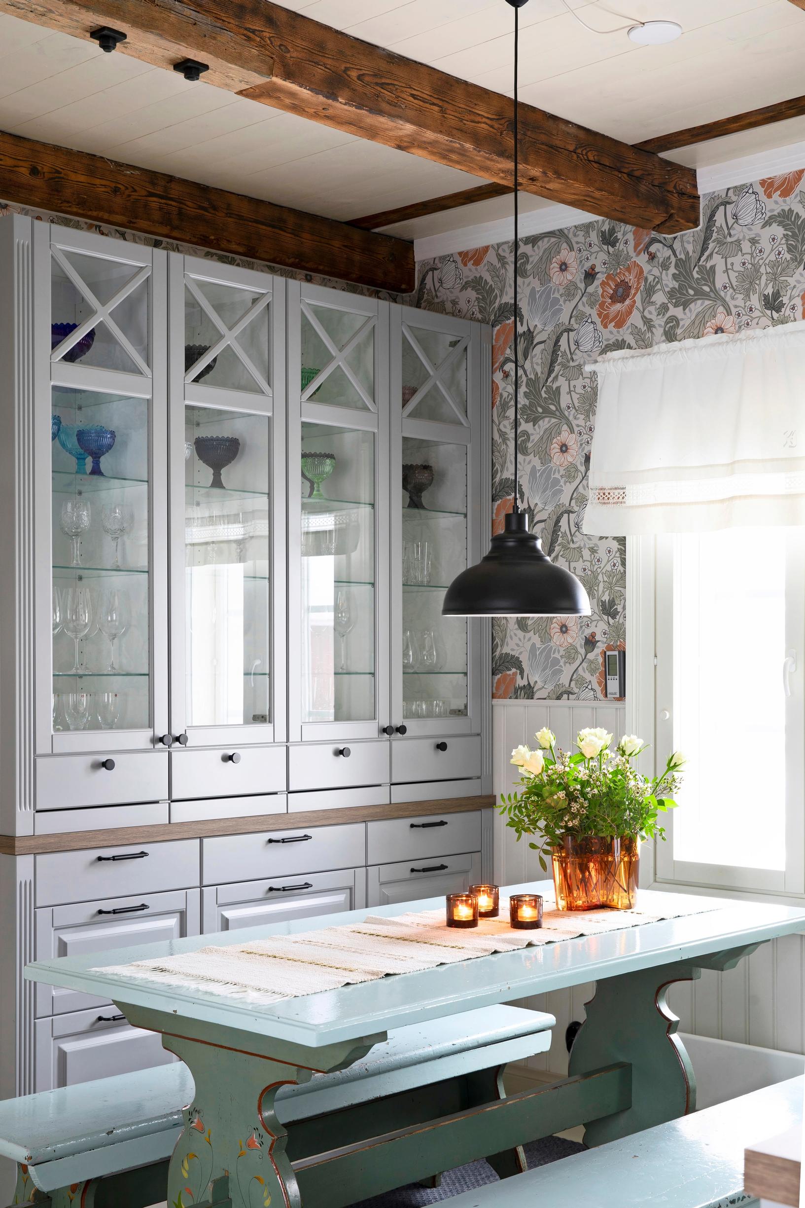 An ornate display cabinet in an old house kitchen