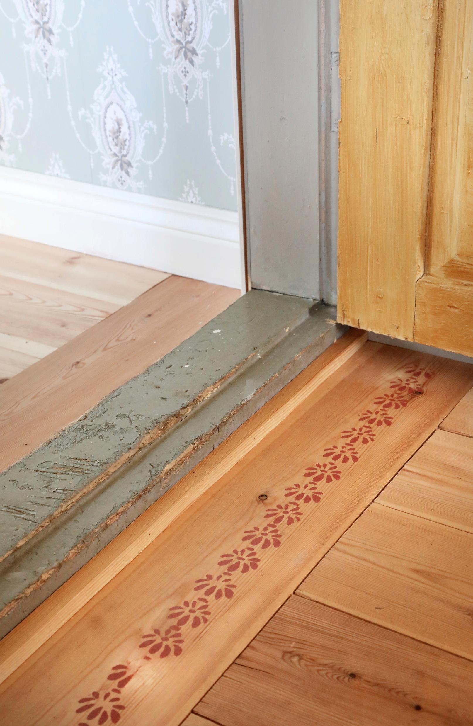 Stencil-painted pattern on the wooden floor