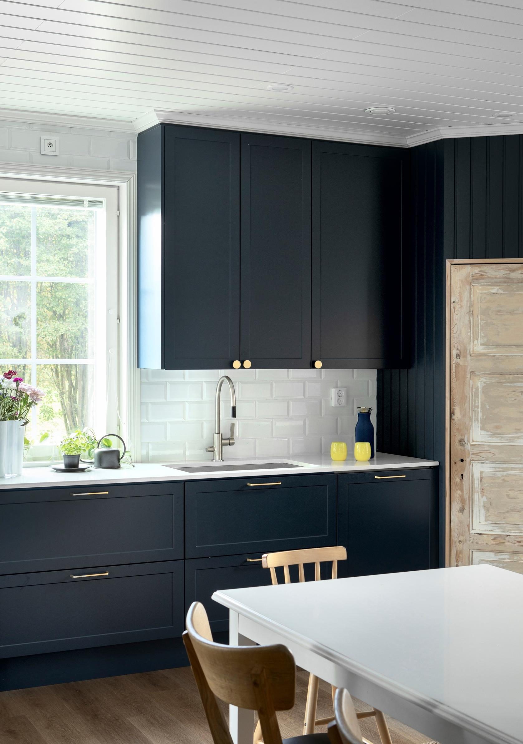White composite countertop in the blue kitchen