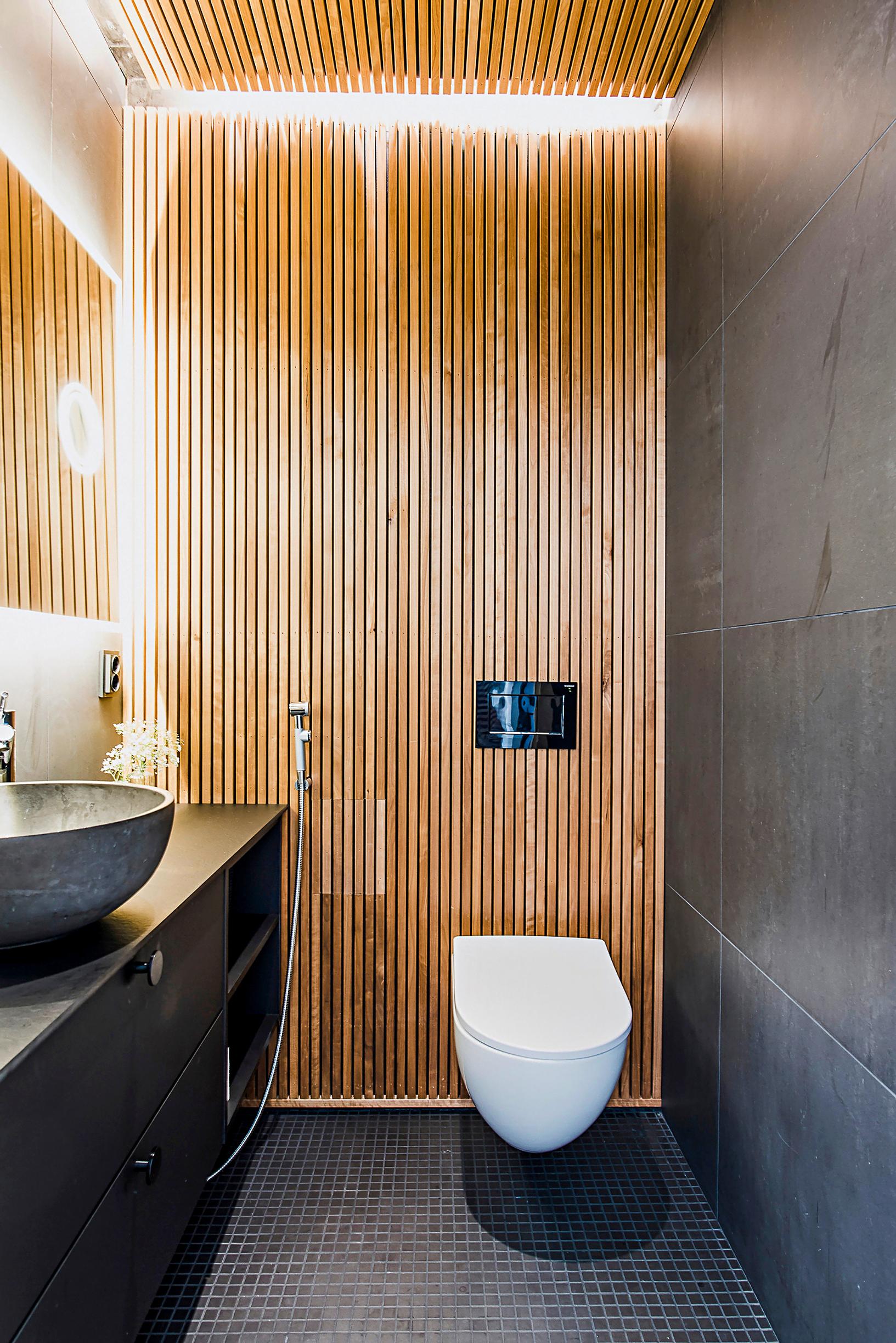 Bathroom wall covered with slats