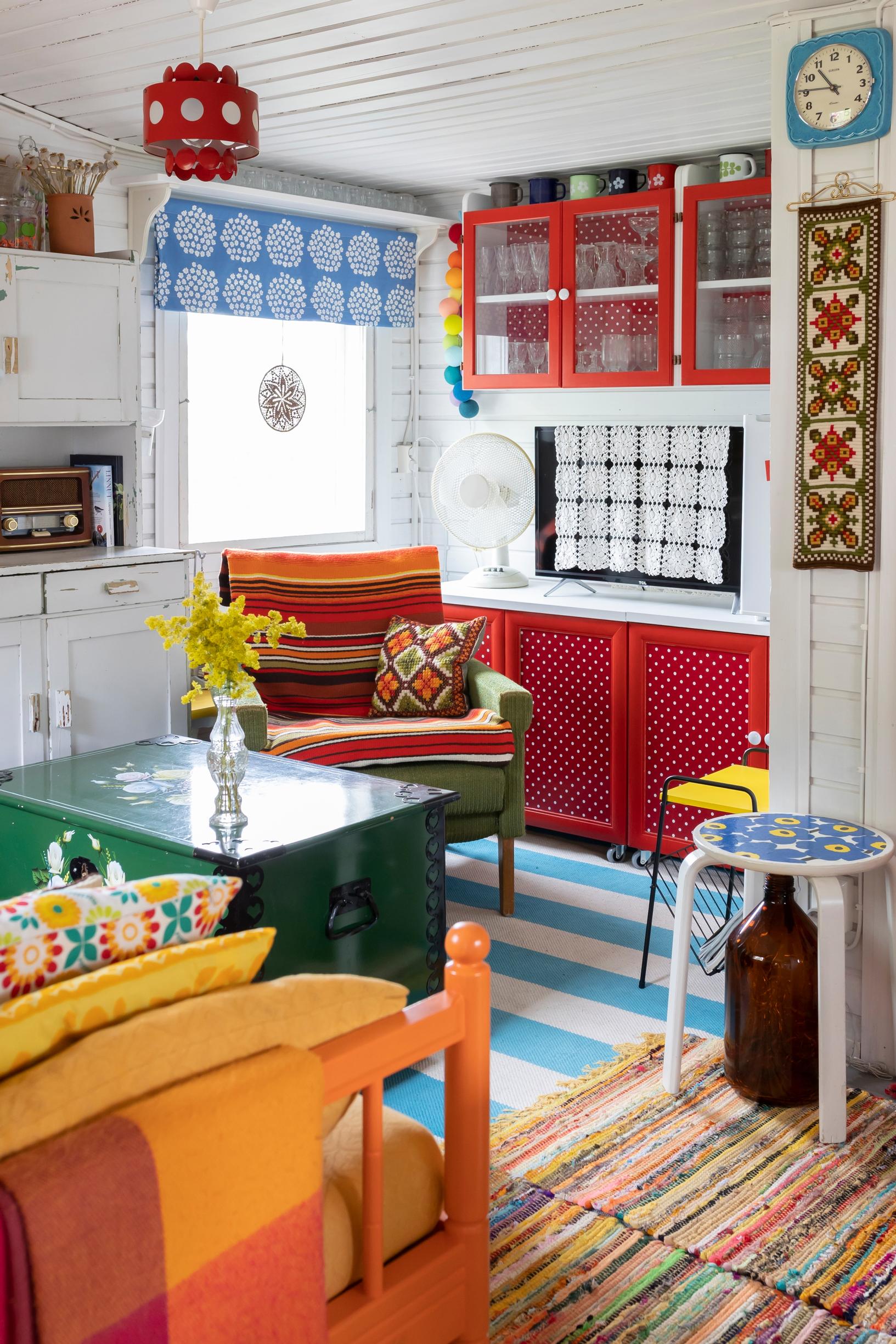 a colorful cottage living room and rag rugs